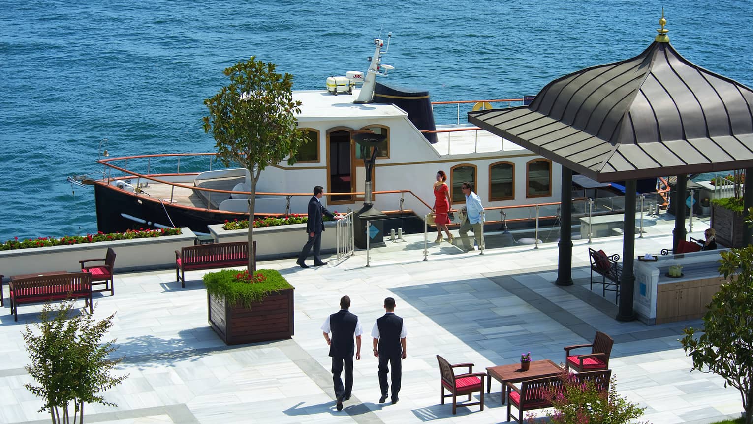 Looking down at people on dock by private cruise yacht 