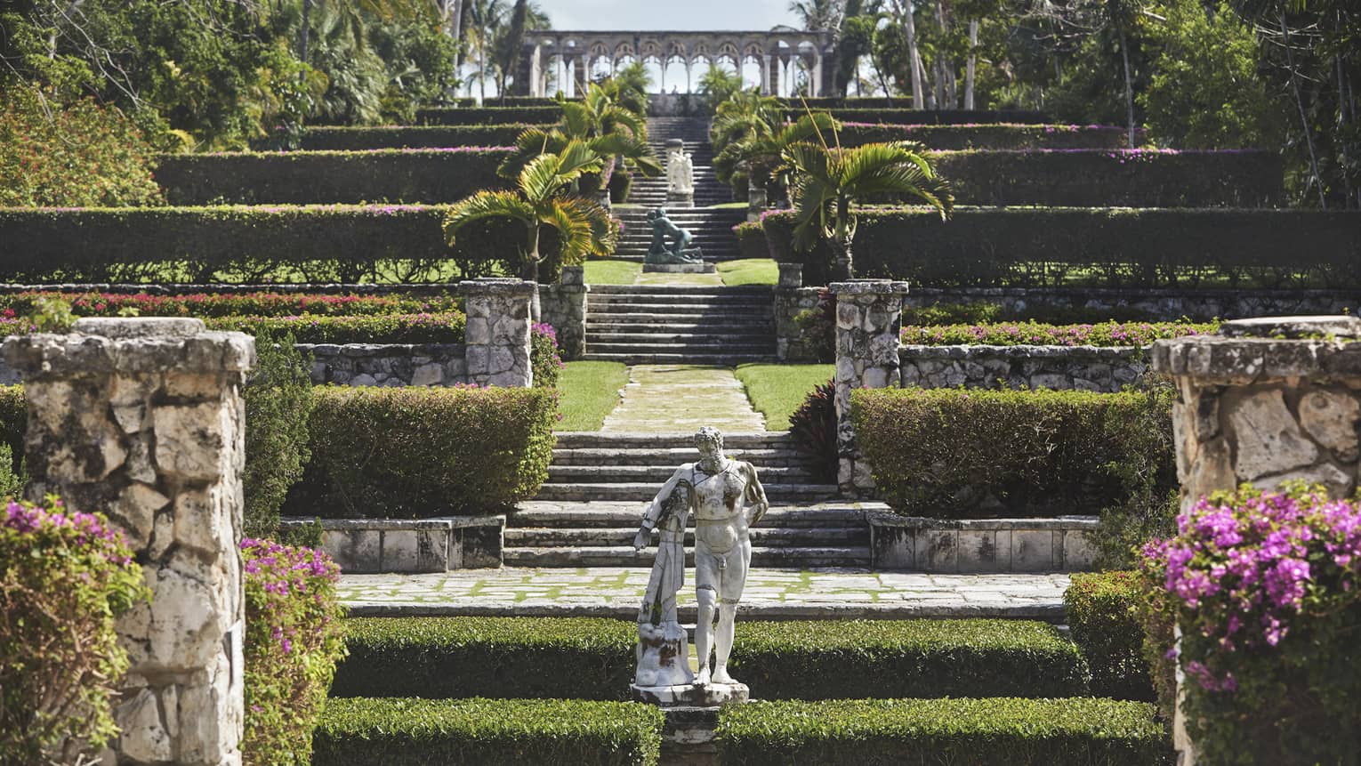 Versailles Gardens with statues, hedges, stone walkways 
