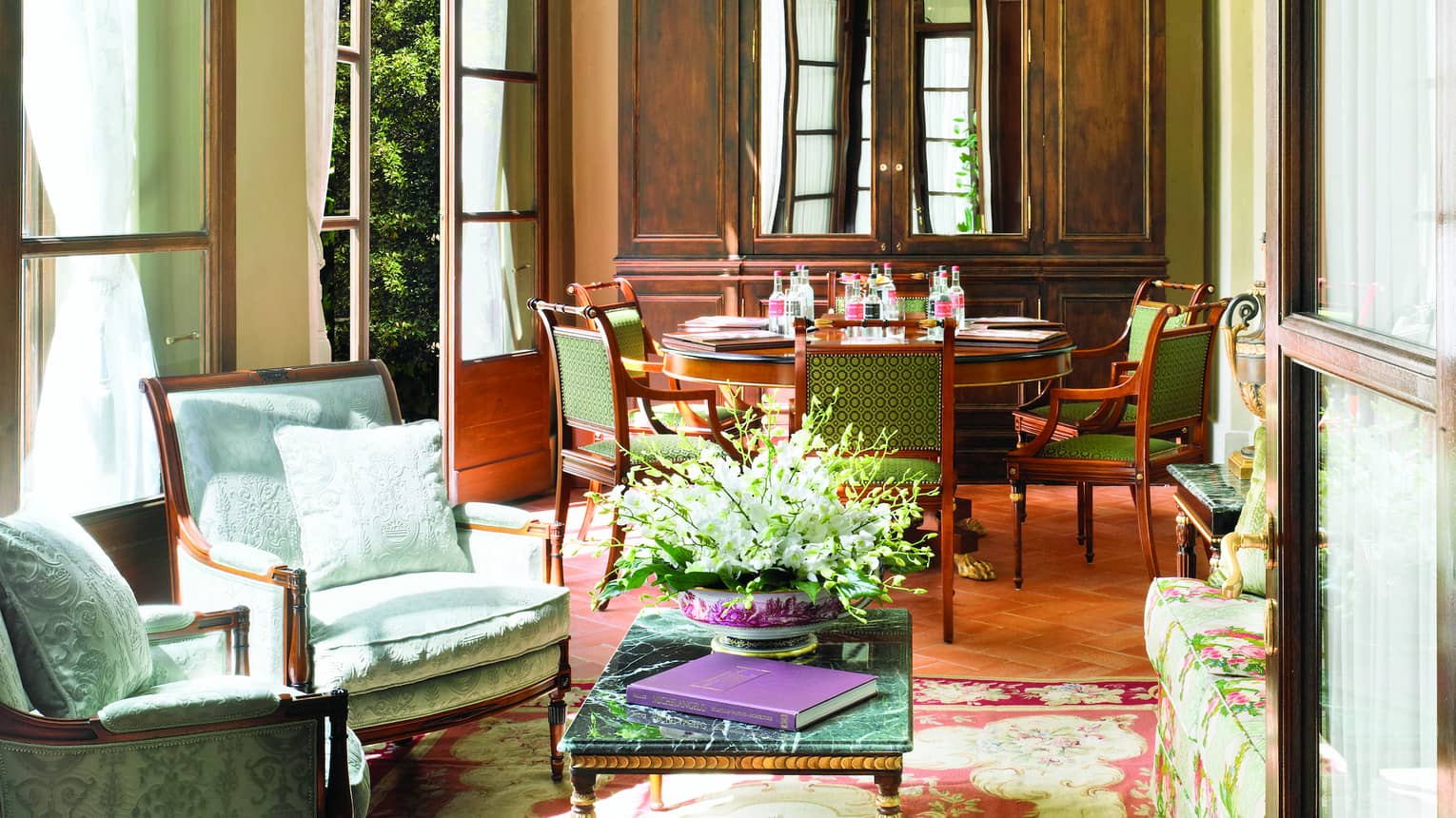 Pinti Room, lantern hangs from arched ceiling over sunny seating area