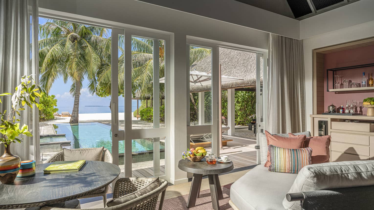 Indoor sitting area and wet bar, leading out to private pool terrace