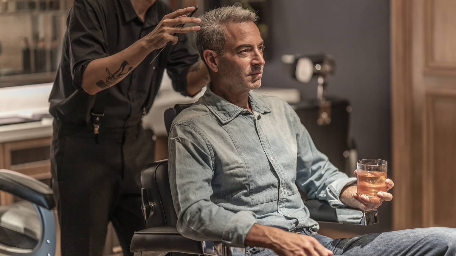 Man receives haircut in the Spa's barbershop