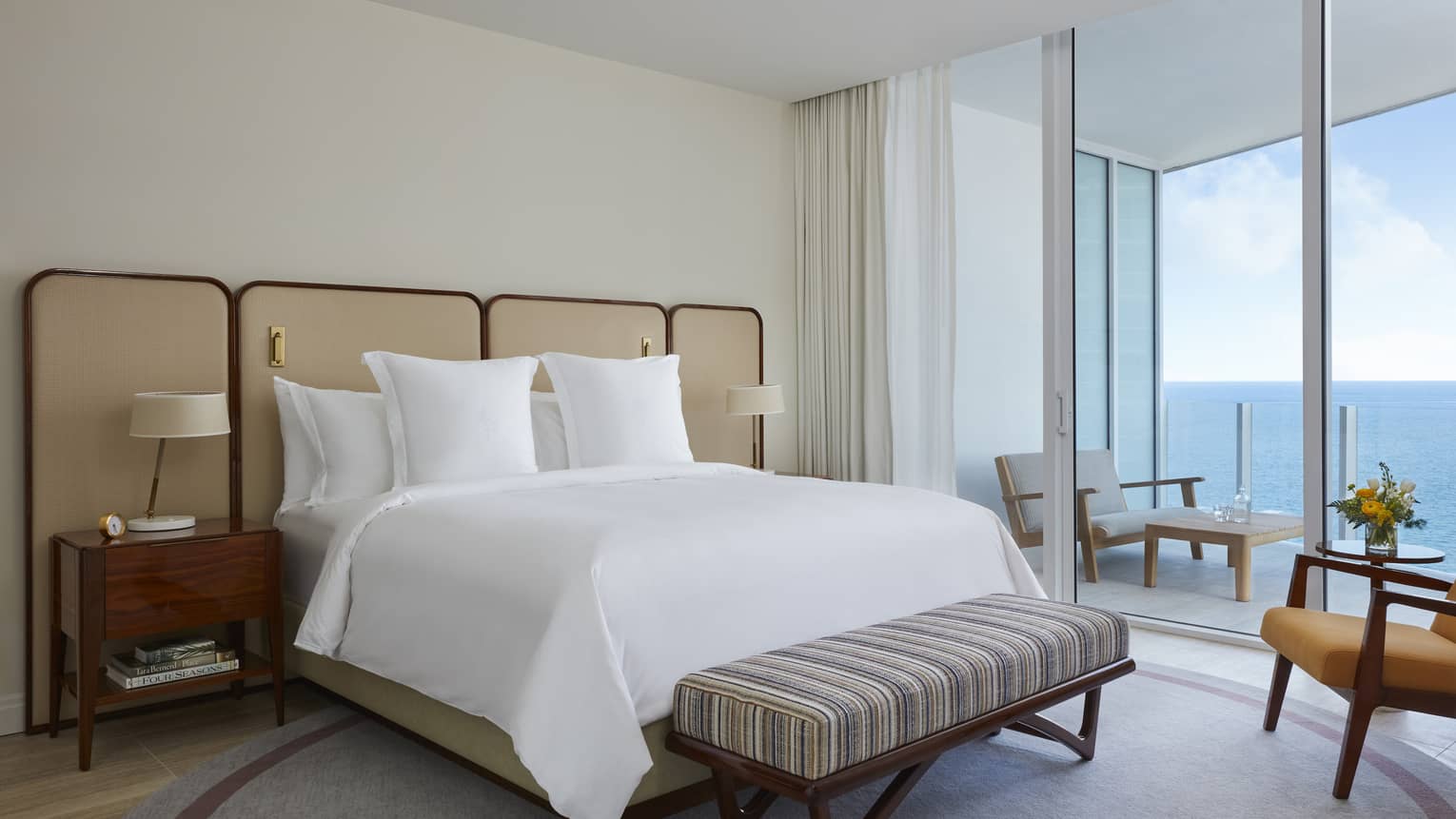 Bedroom with king bed and ocean-view balcony