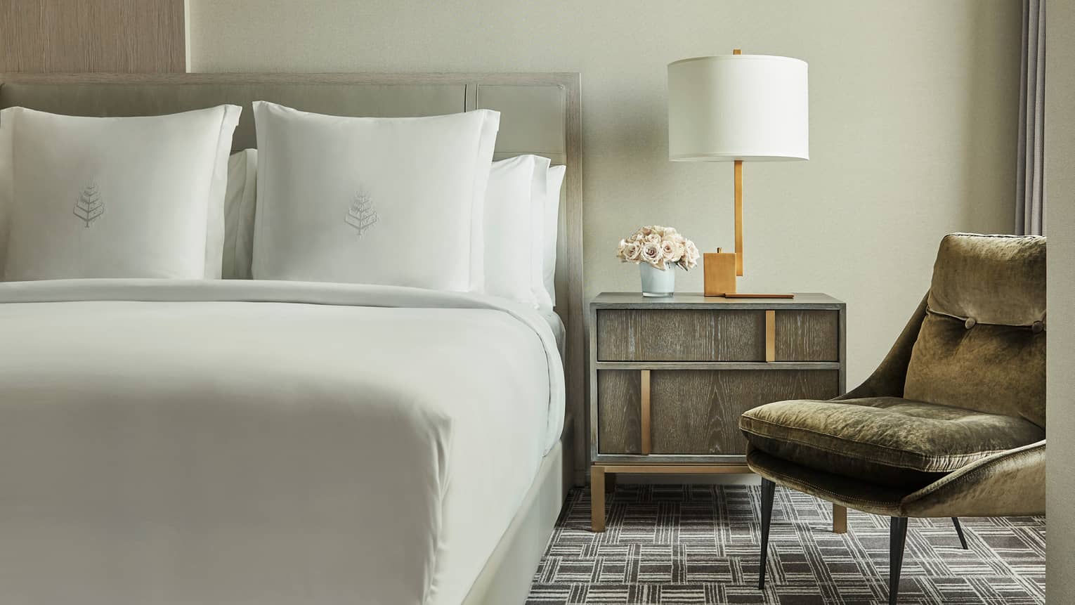 Superior Room bed, nightstand with lamp, mid-century style velvet armchair