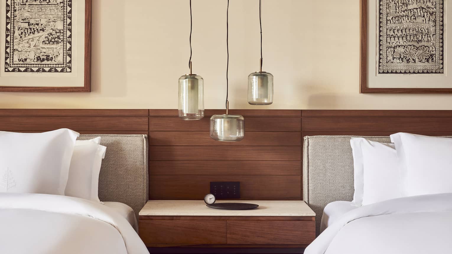 Hotel room with nightstand in between two beds