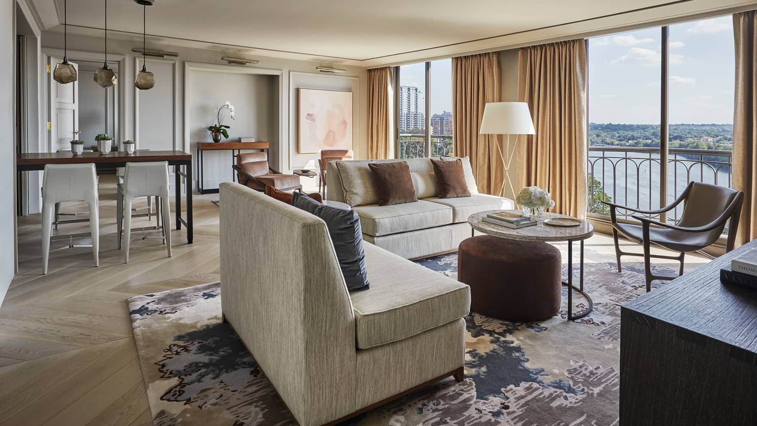 Hotel room dining stools, seating area by room-length floor-to-ceiling windows