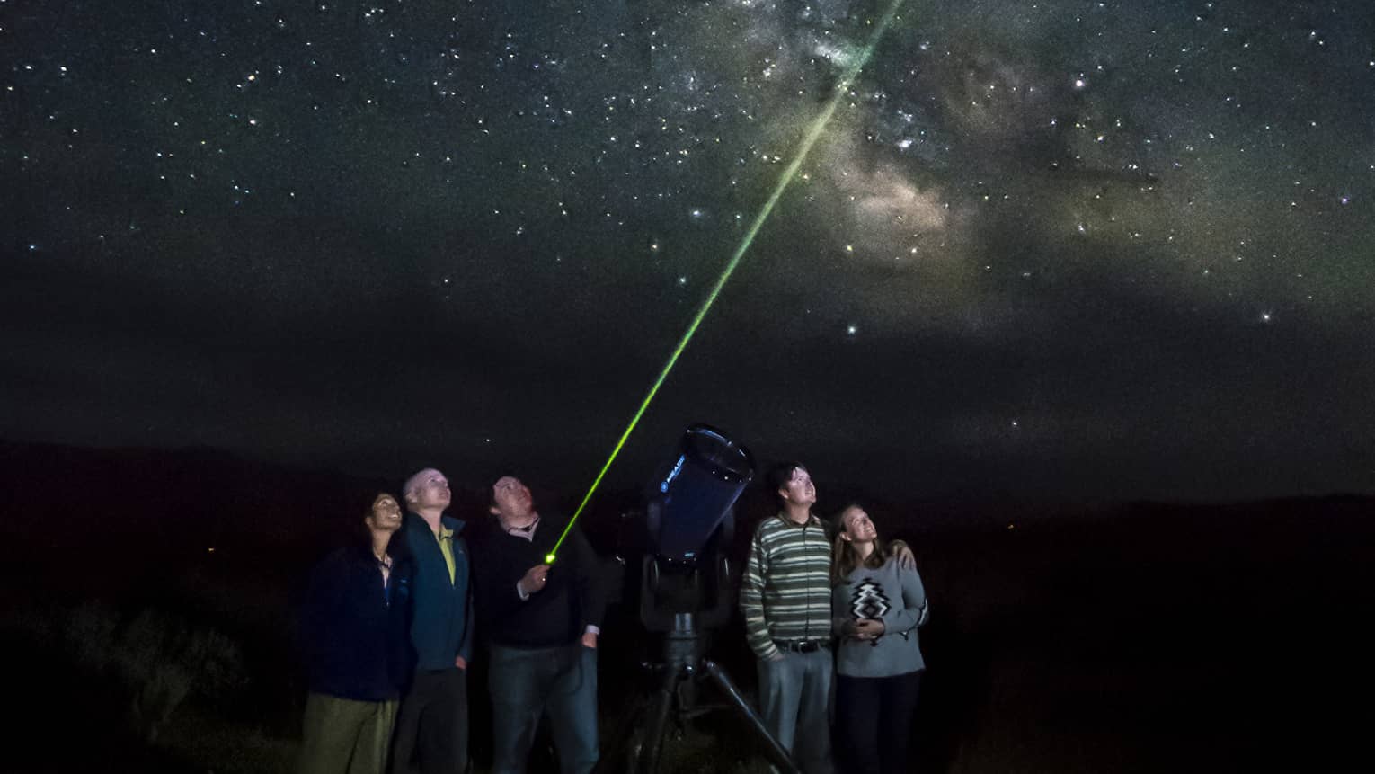 guests stargazing together