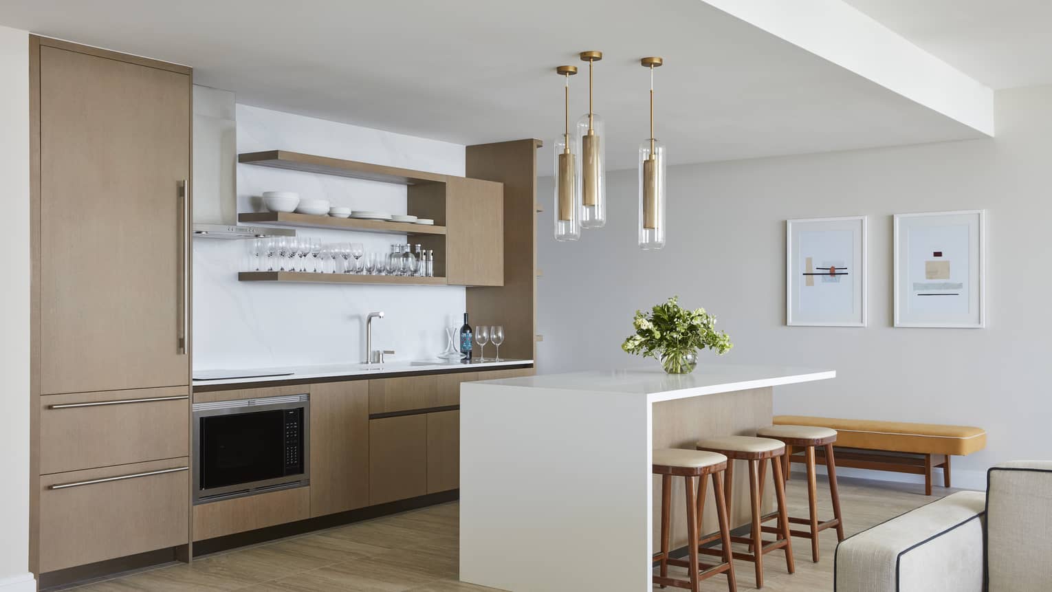 Modern kitchen and island with three bar stools