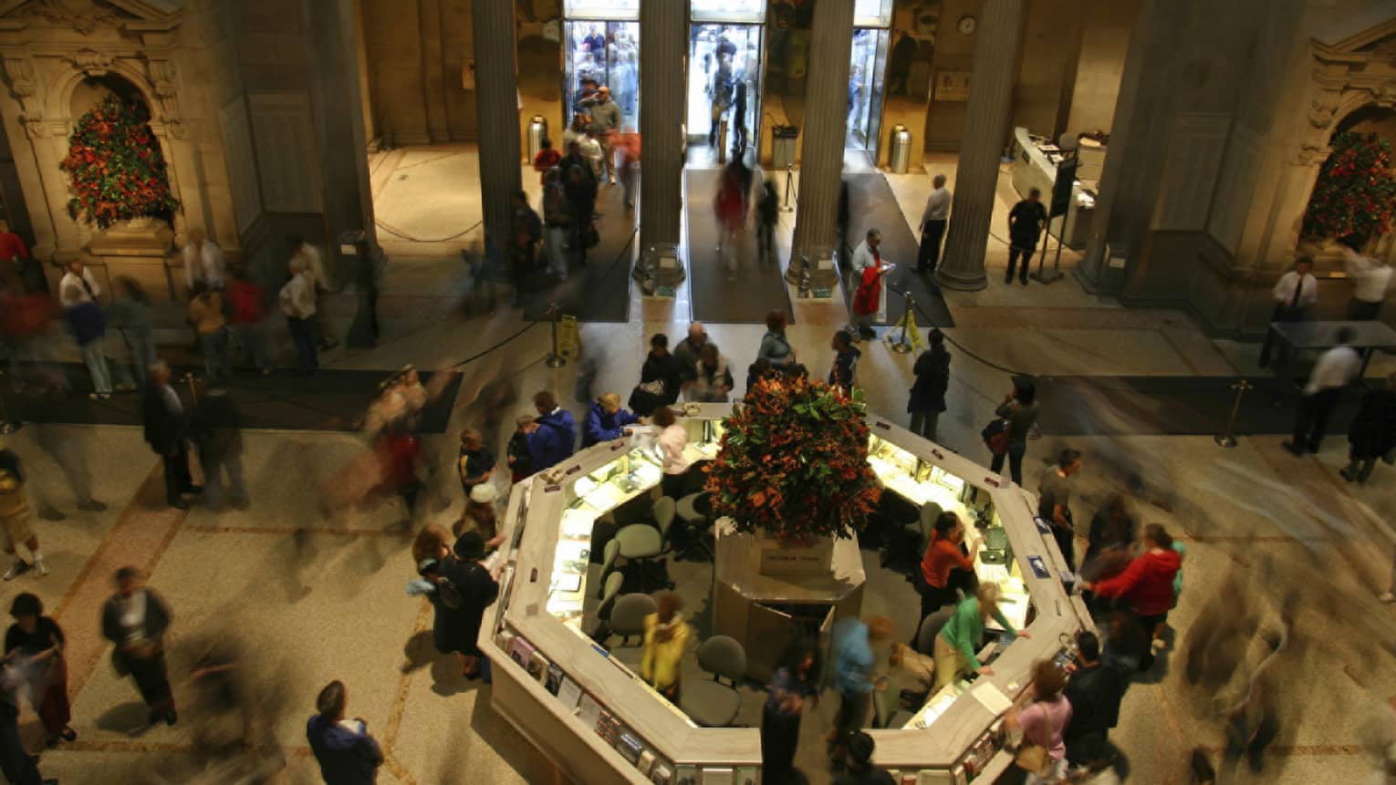 View over crowds gathered around reception desk and lobby at the Metropolitan Museum of Art 