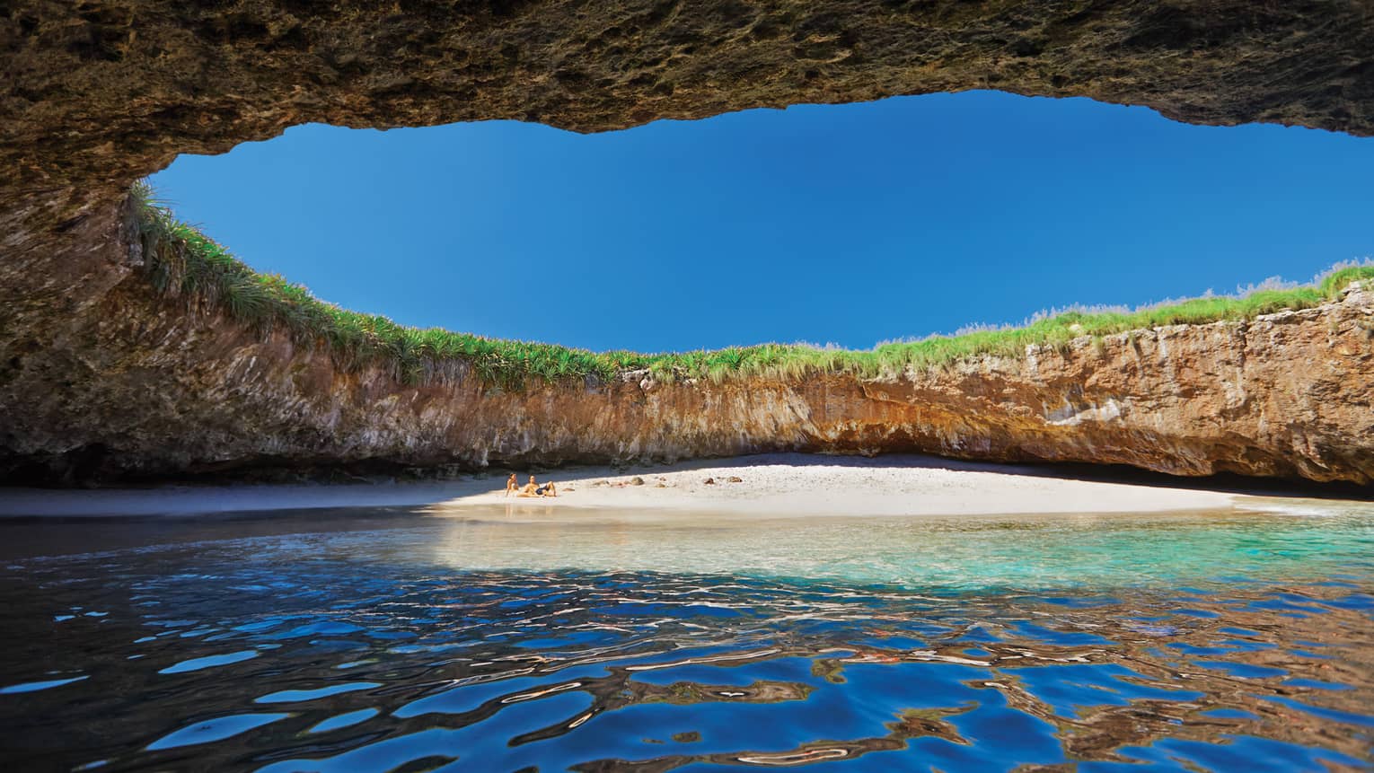 Hidden beach under opening in Marietas Islands cave