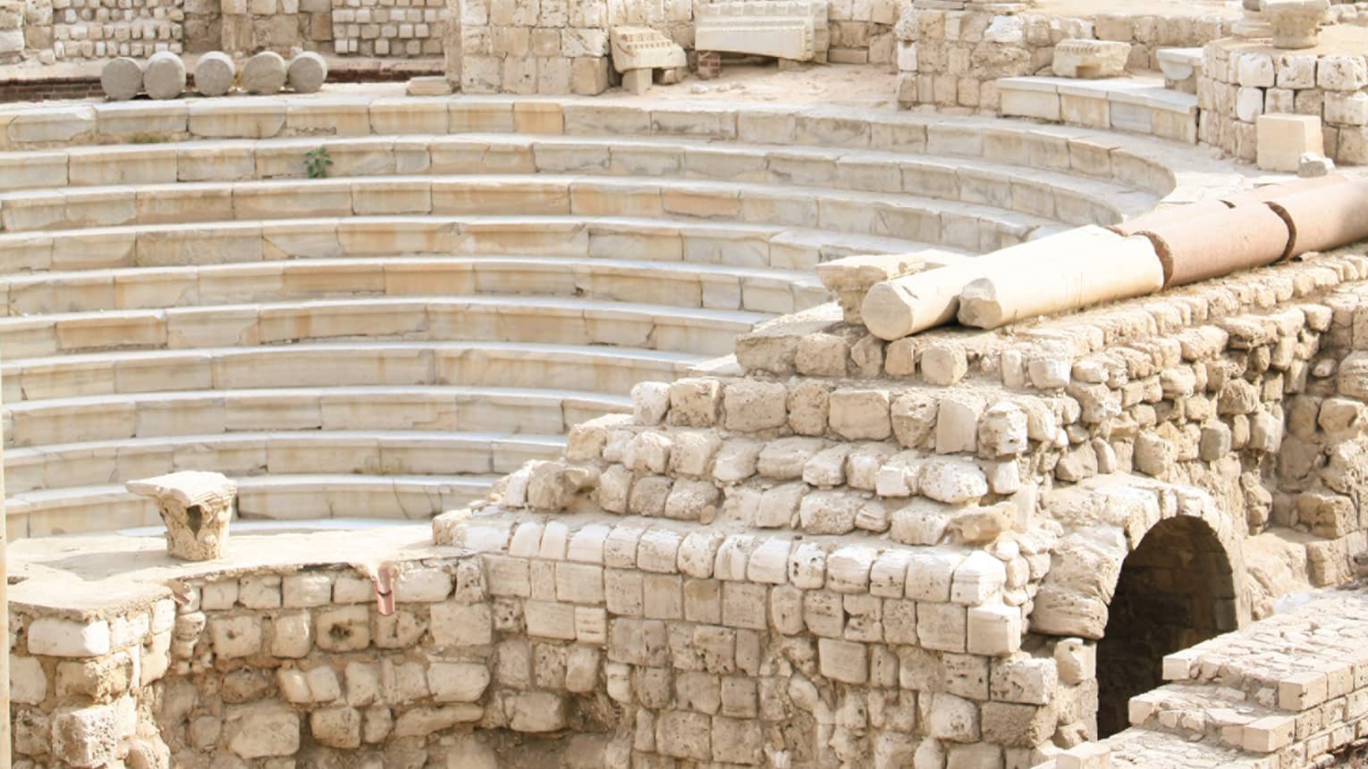 Alexandria’s Roman Amphitheatre, trees and buildings in background 