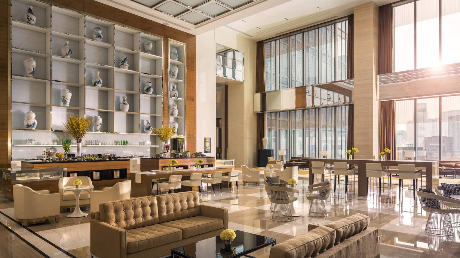 Bright Ballroom Foyer seating areas, bar under tall loft-like windows and ceiling