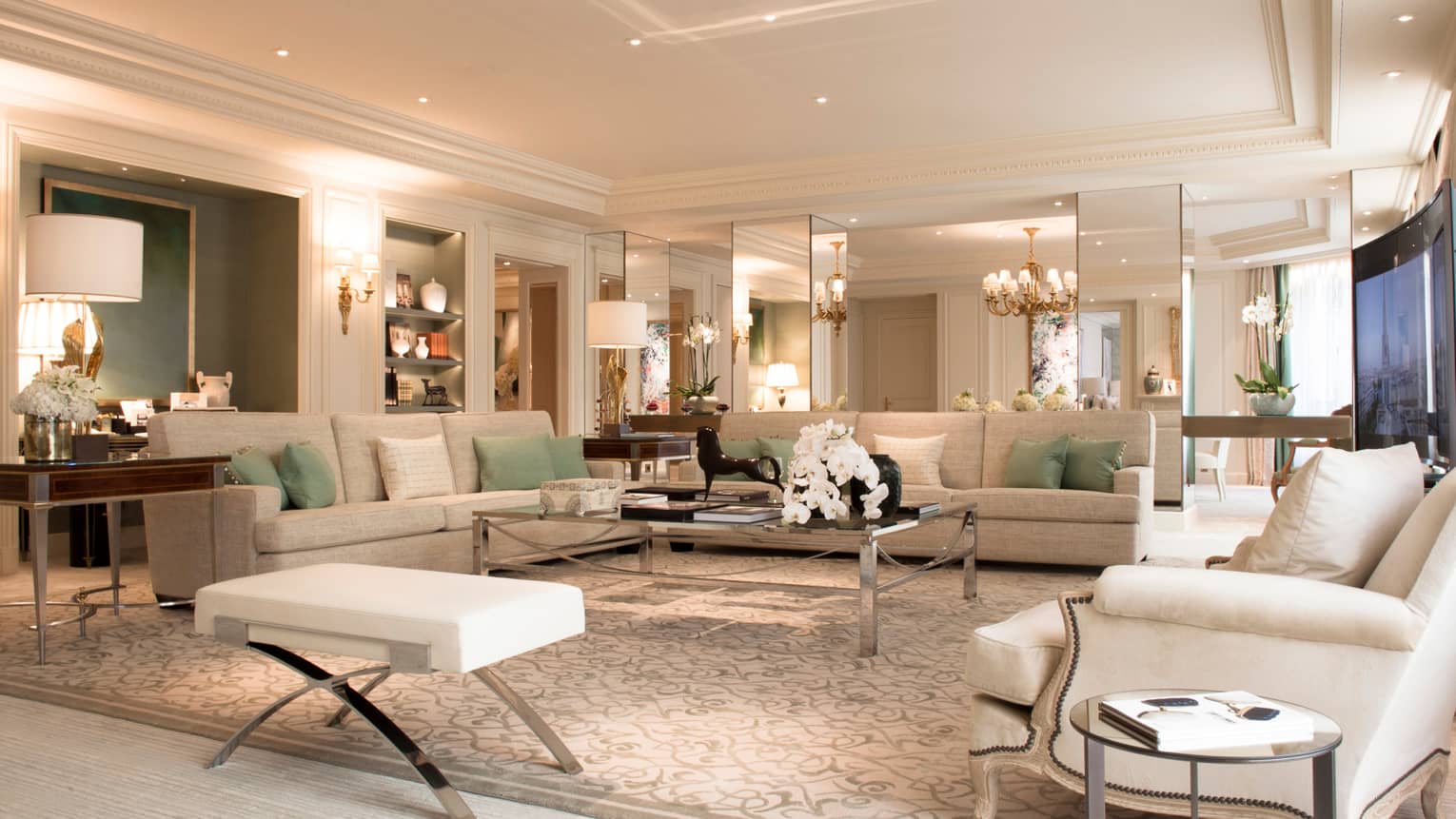 Royal Suite large living room, white sofas, armchairs, lamps, mirror walls