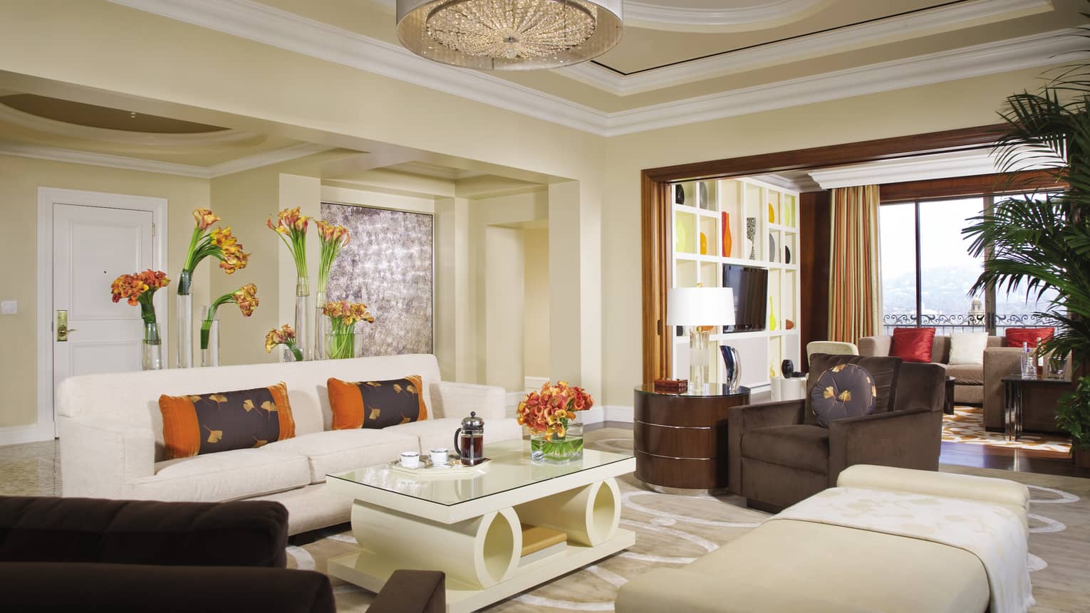 Penthouse Suite white sofa, modern coffee table, chaise, armchair by second seating area