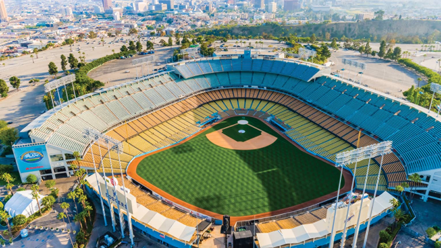 Football stadium with city buildings in the background.