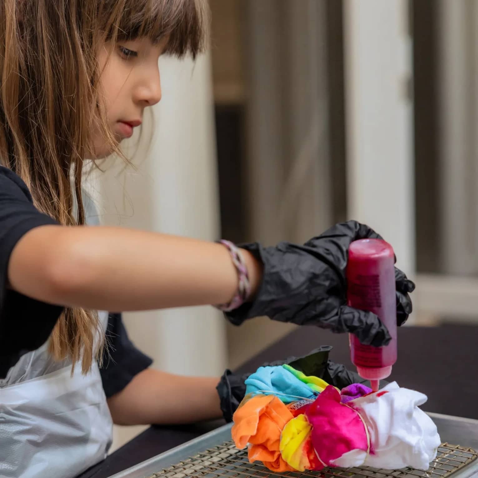 Child doing a colourful arts and crafts project