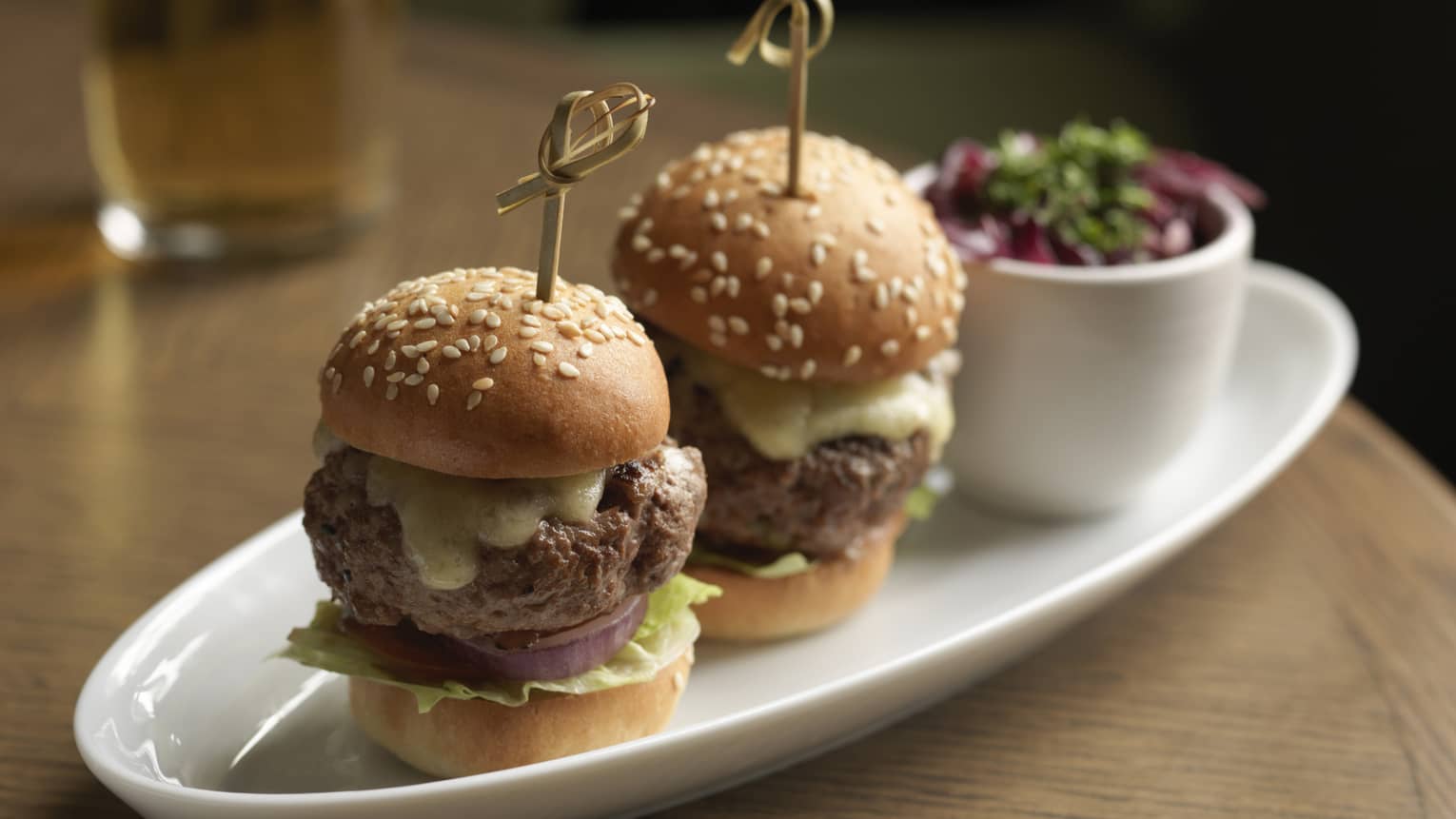 Two Kobe beef sliders served with kimchi slaw and smoked Gouda