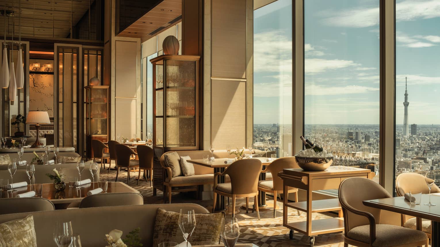 Hotel restaurant with floor to ceiling views of city