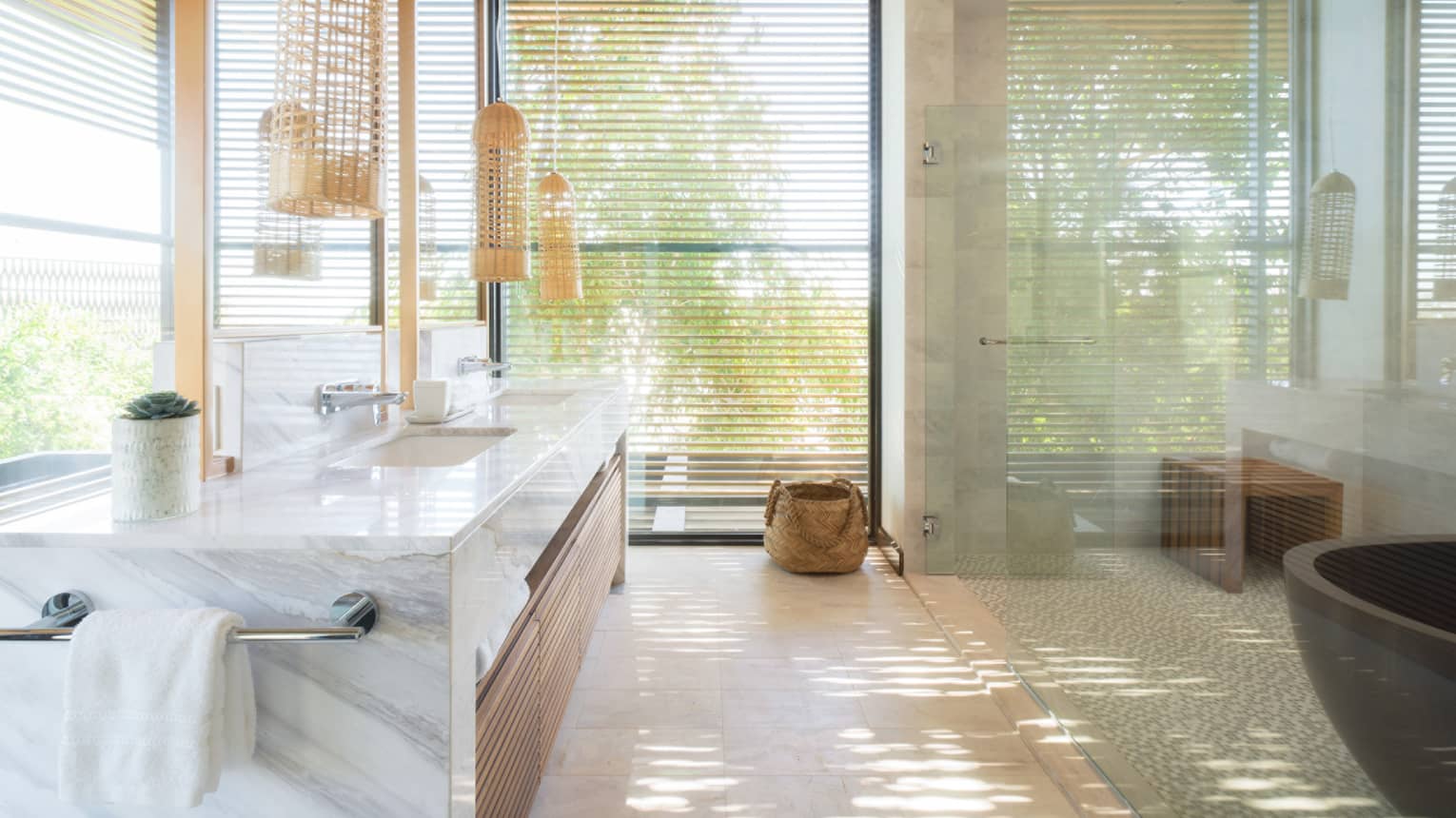 Bathroom with large glass shower and windows