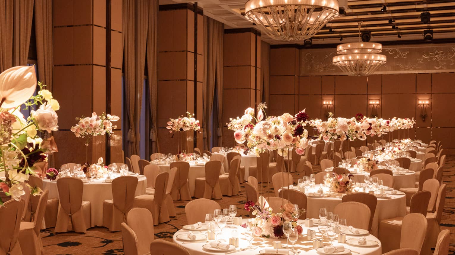 Grand indoor ballroom set for wedding