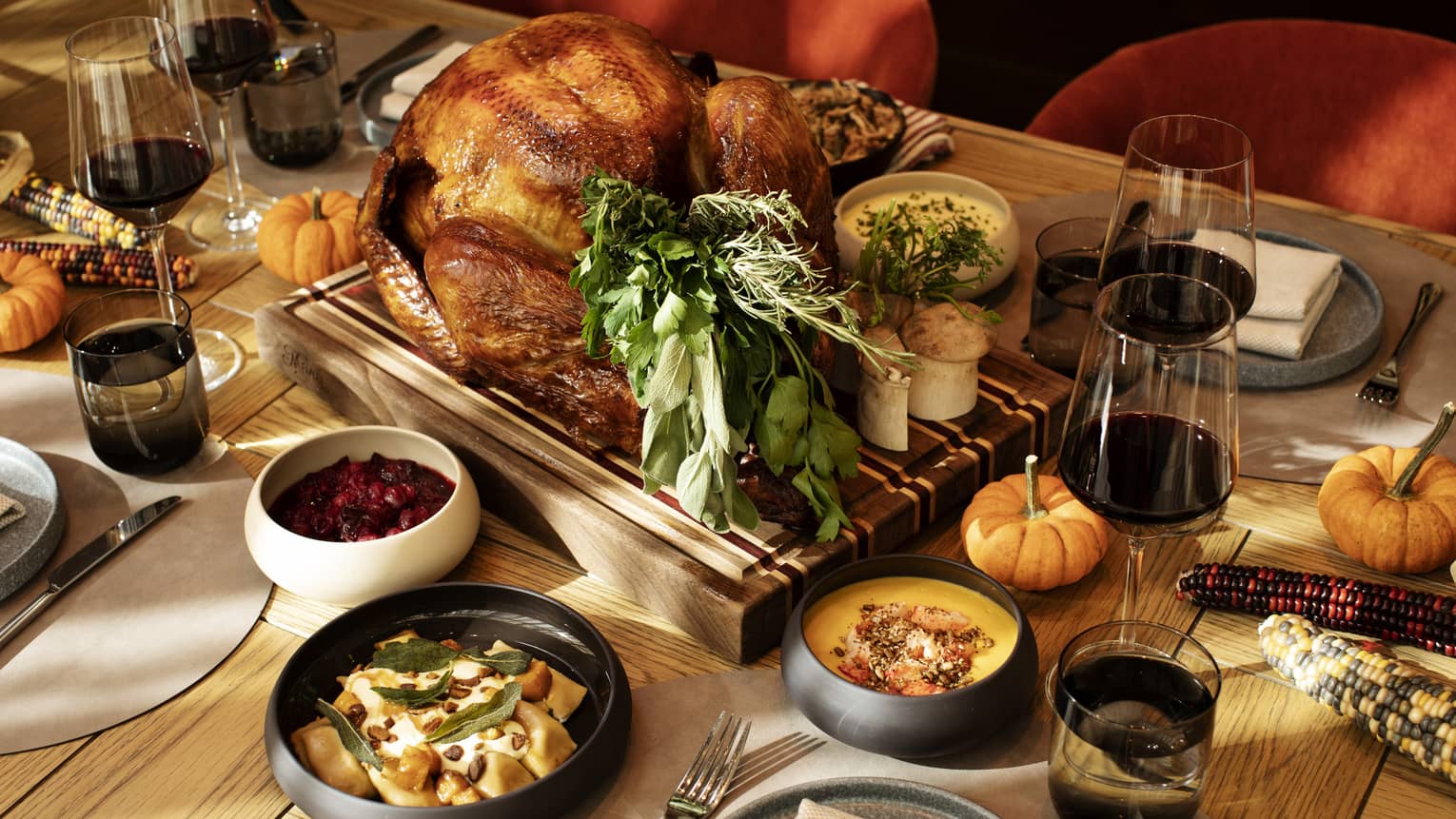 An assortment of autumn or Thanksgiving food, including turkey.