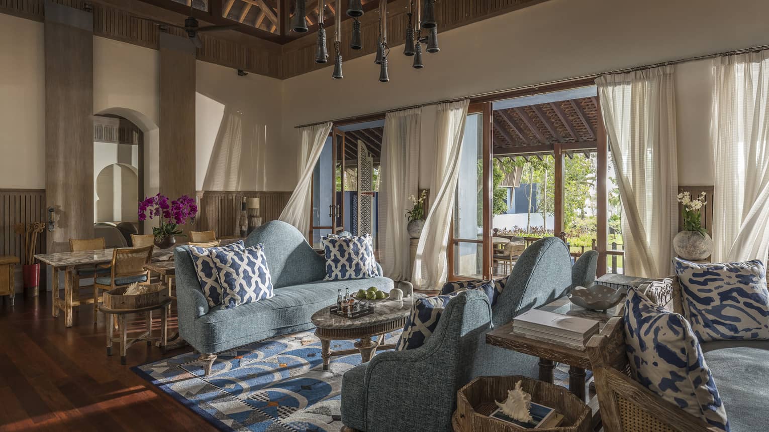 Three Bedroom Villa living room with two soft blue couches and airy views