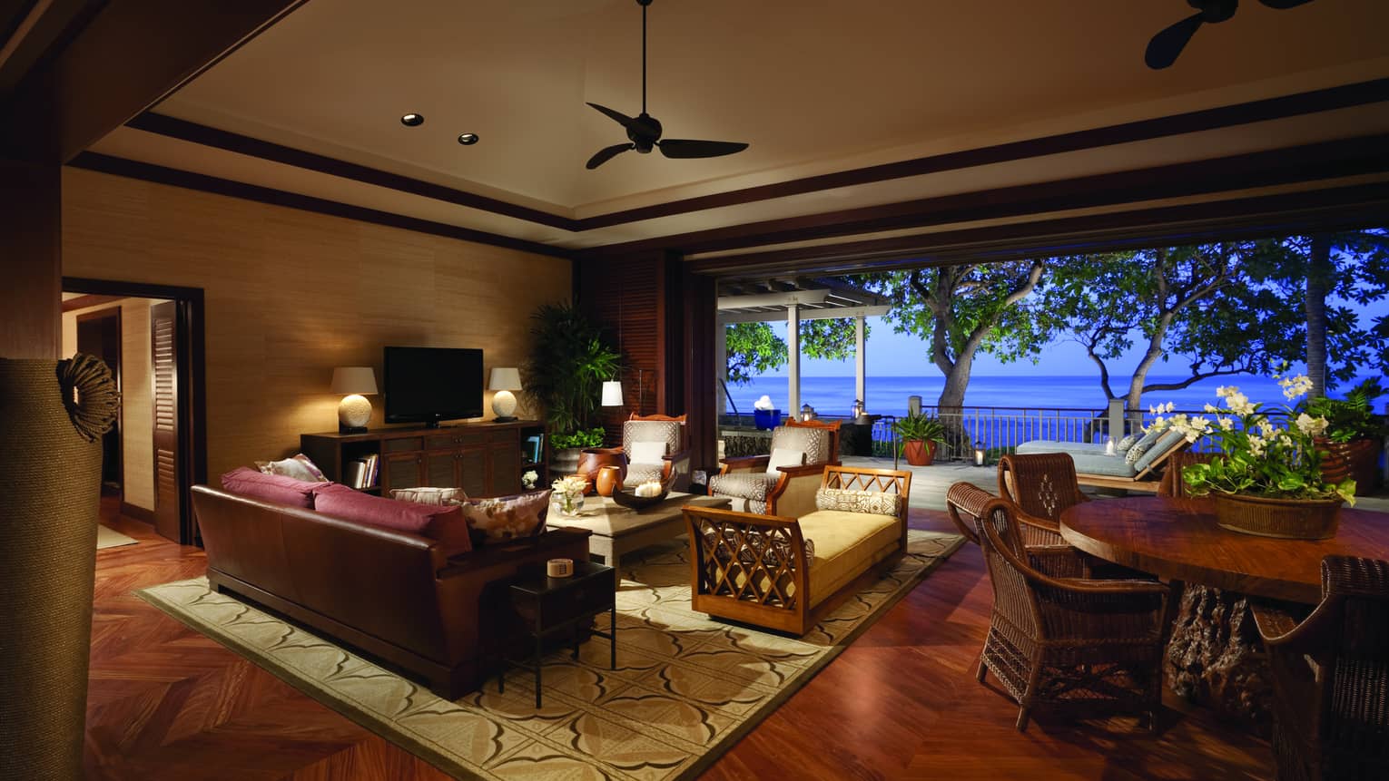Hawaii Loa Presidential Villa seating area, large round wood table, open wall to patio