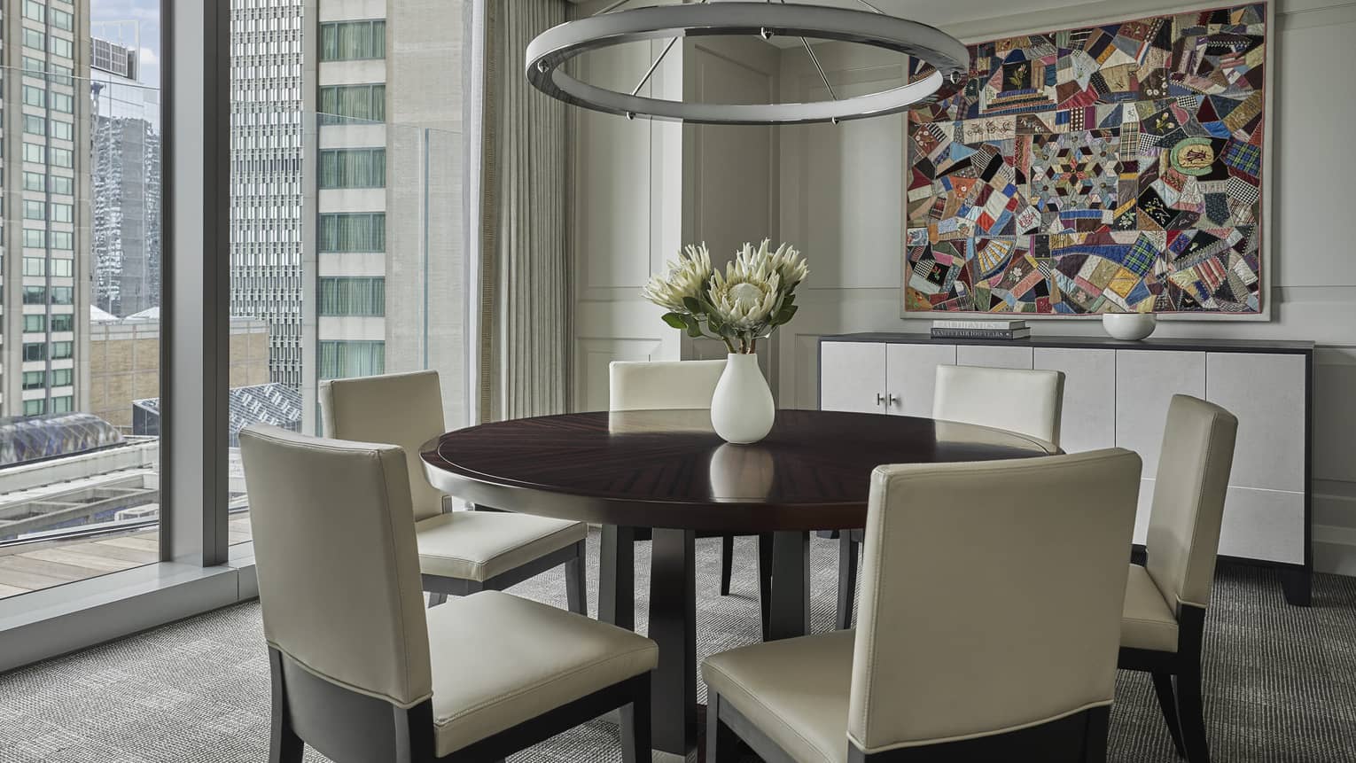 The dining table in a suite overlooks downtown Boston 
