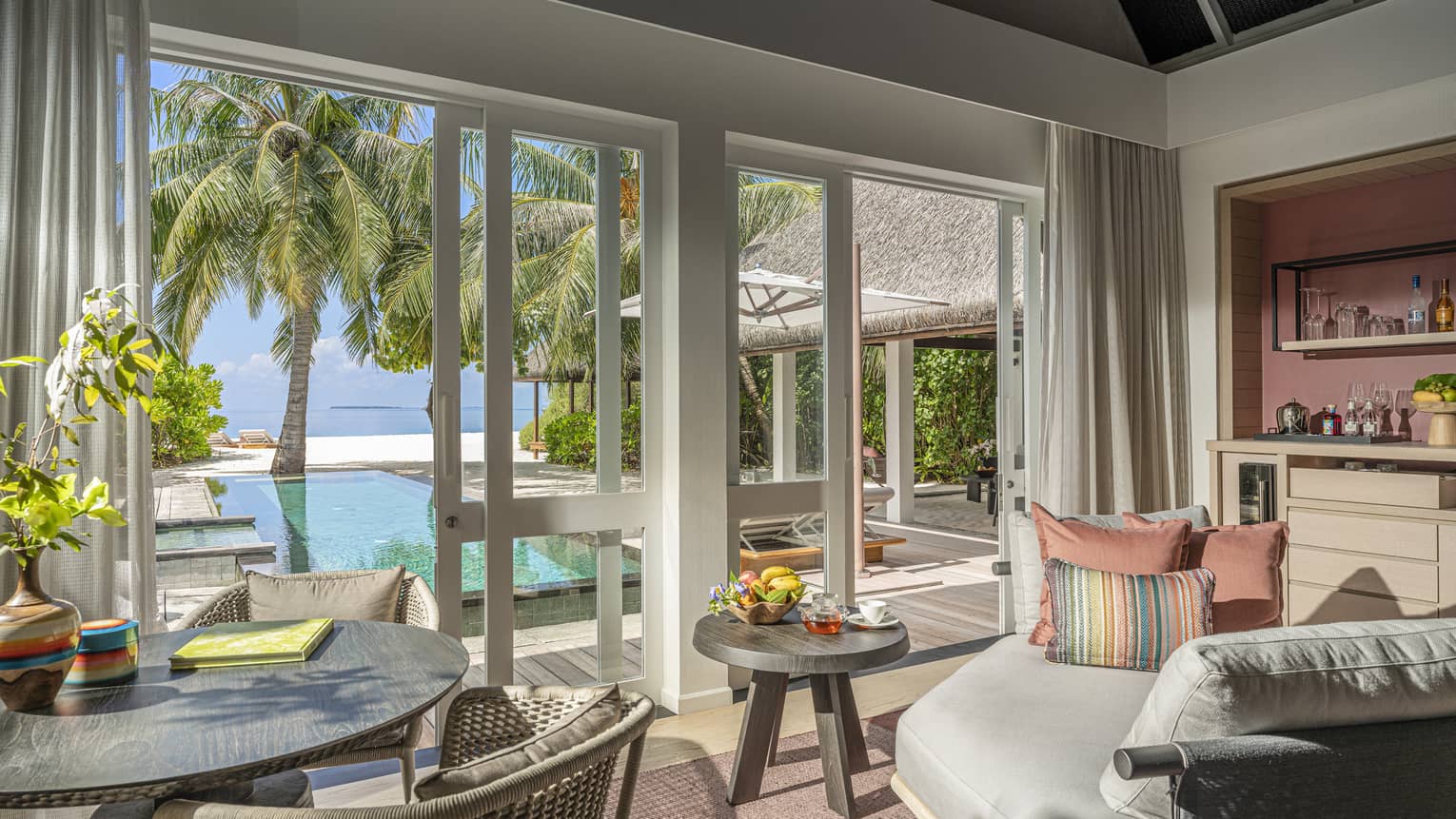 Indoor sitting area and wet bar, leading out to private pool terrace