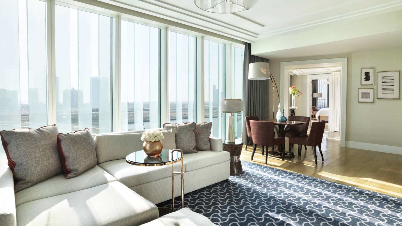 Abu Dhabi Hotel Luxury Four Seasons Al Maryah Island Deluxe Four Seasons Executive Suite Large Living Room With L Shaped White Sofa Against