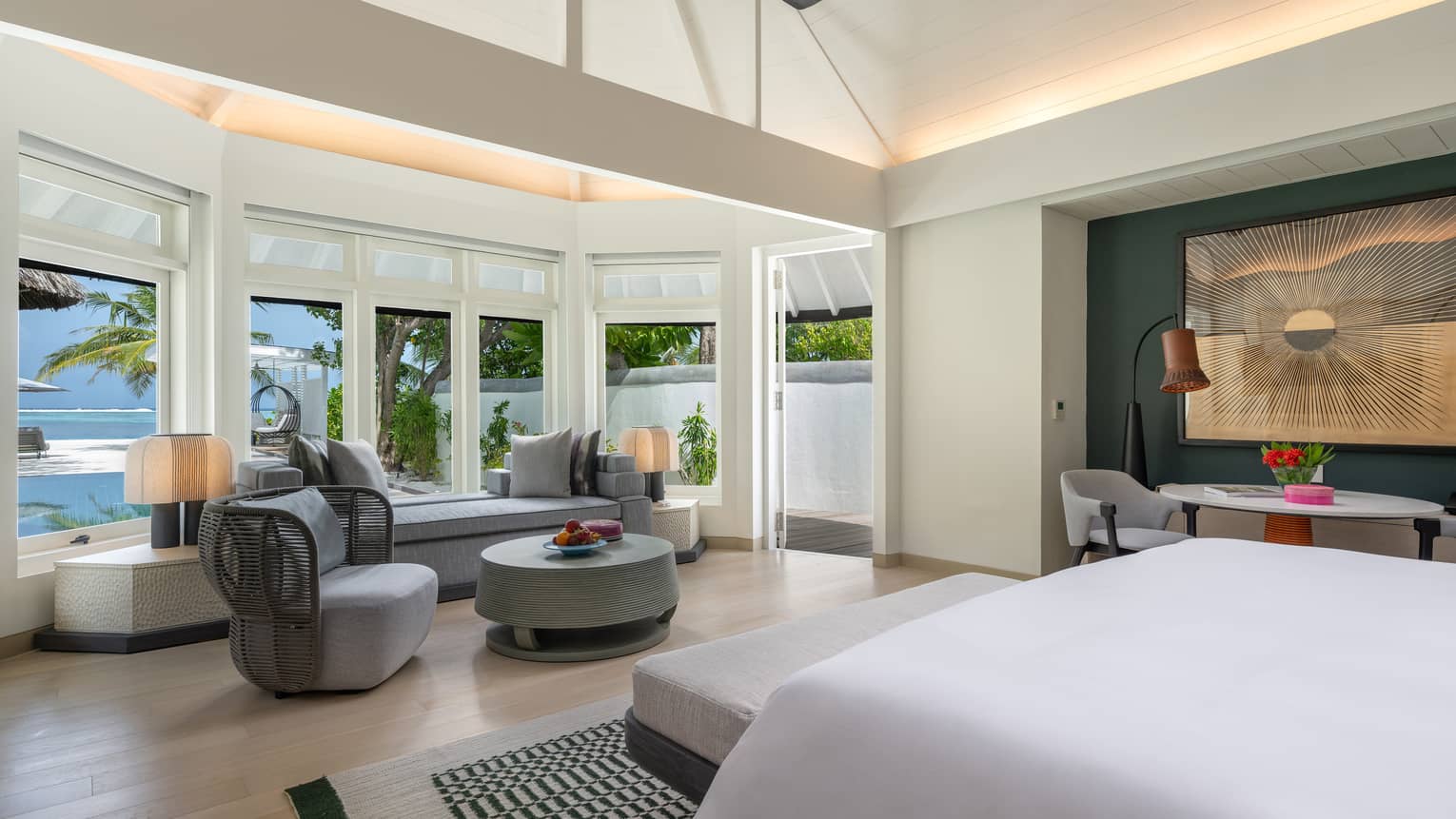 Inside the primary bedroom of the sunrise family beach villa with pool
