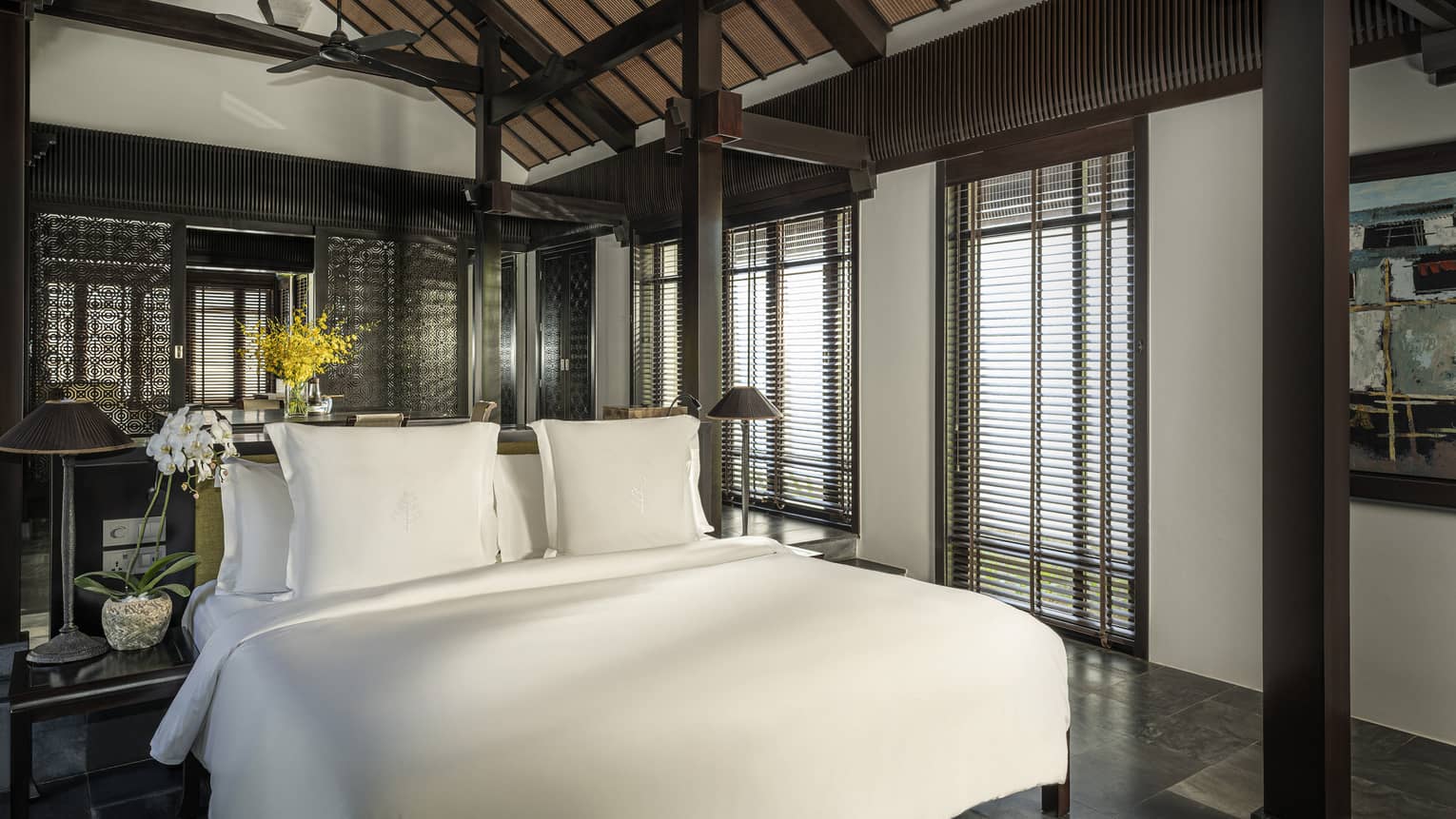 King bed in a private villa with vaulted ceiling