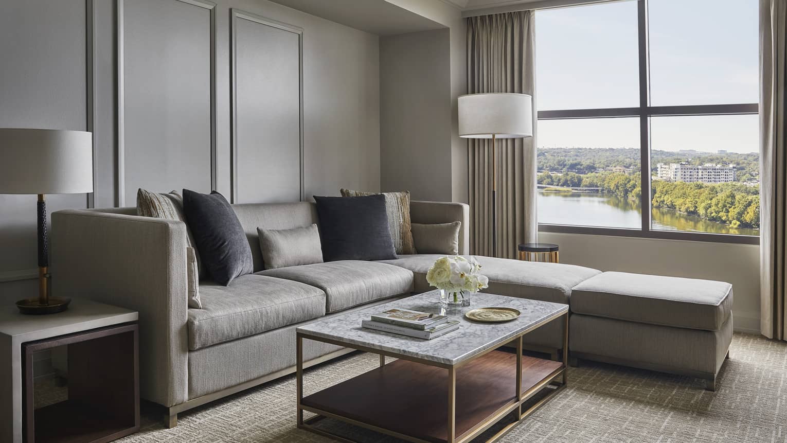 Living room with sectional sofa and Austin lake view