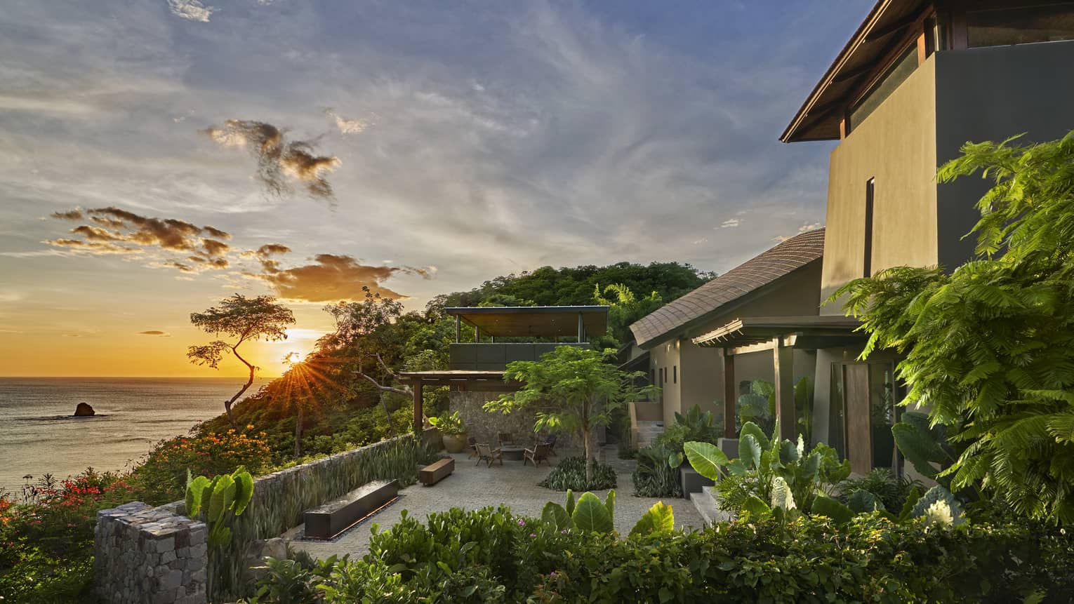 Villa terrace overlooking sea at sunset