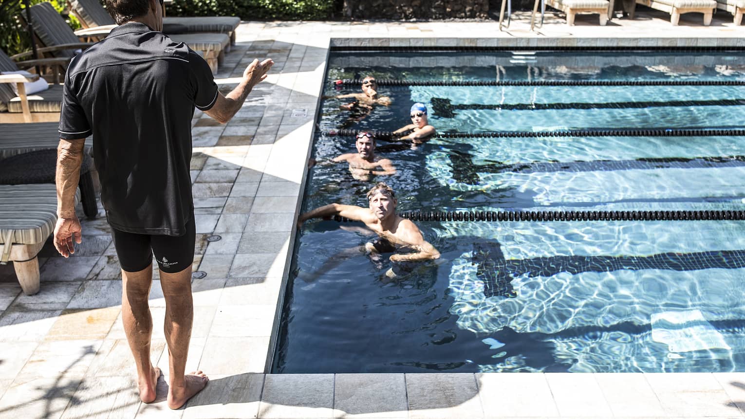 Guests in a pool, training for a triathlon with Dave Scott