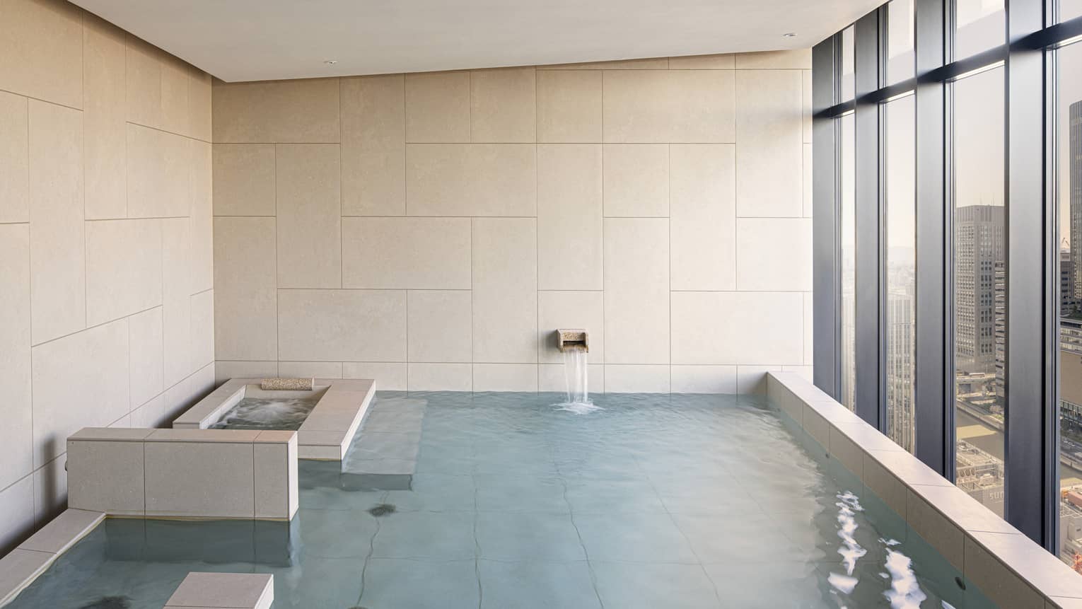 Four Seasons Hotel Osaka Japanese ofuro tub with wall of windows looking out to Osaka city