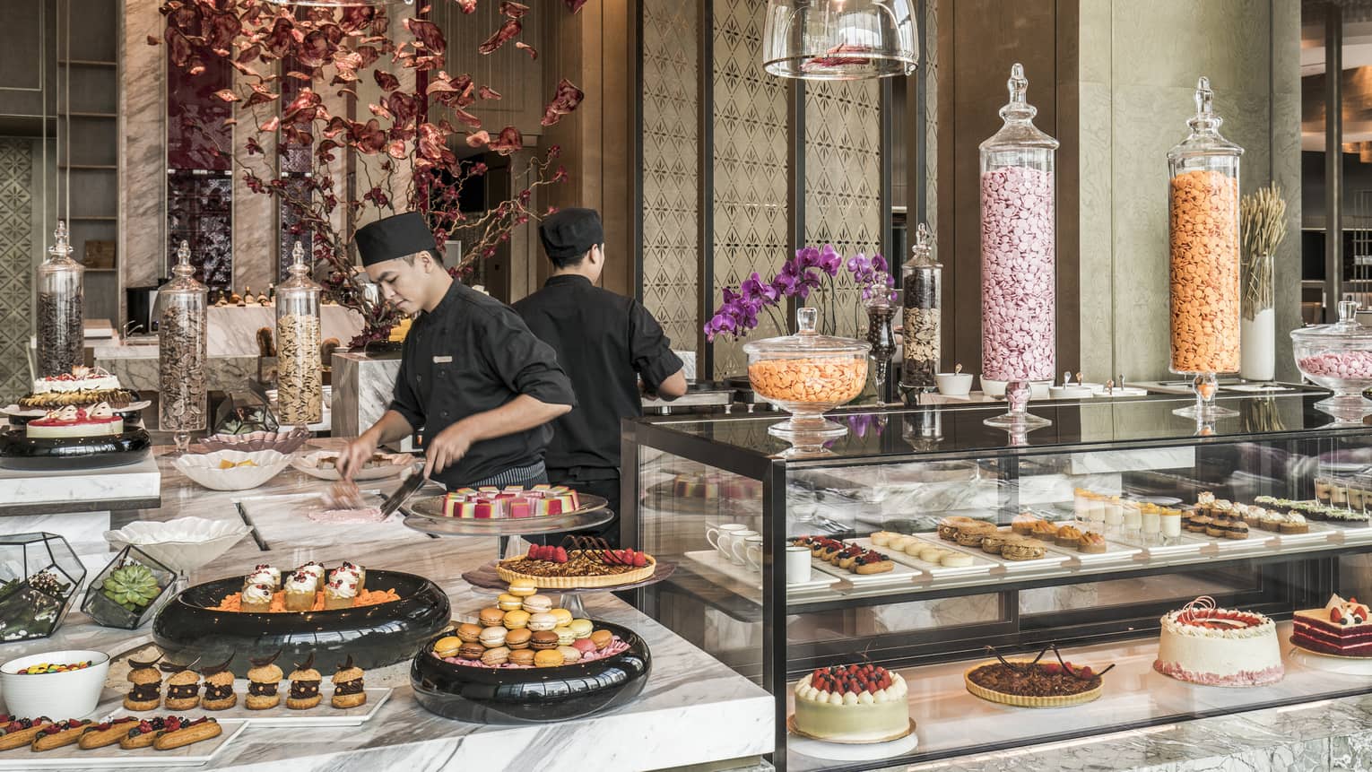 Curate dessert station with two chefs making treats