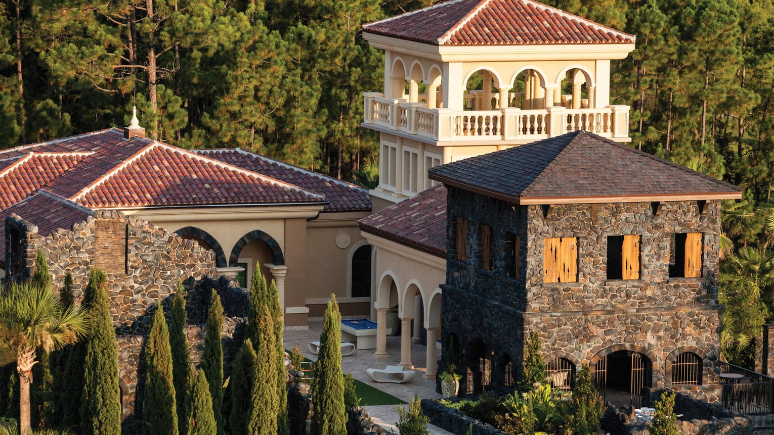 View over Kids Centre mansion with stone buildings, patio