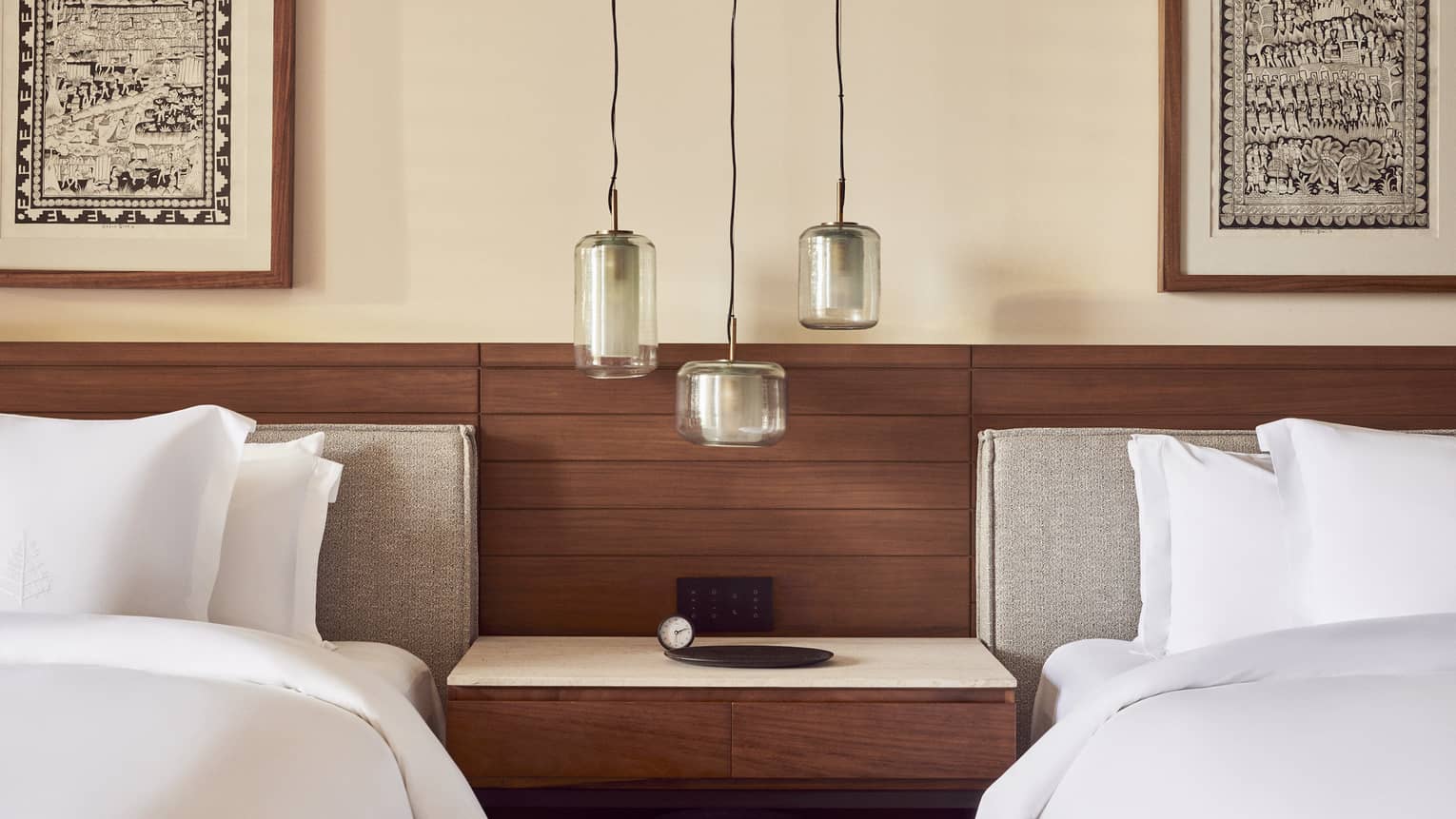 Hotel room with nightstand in between two beds