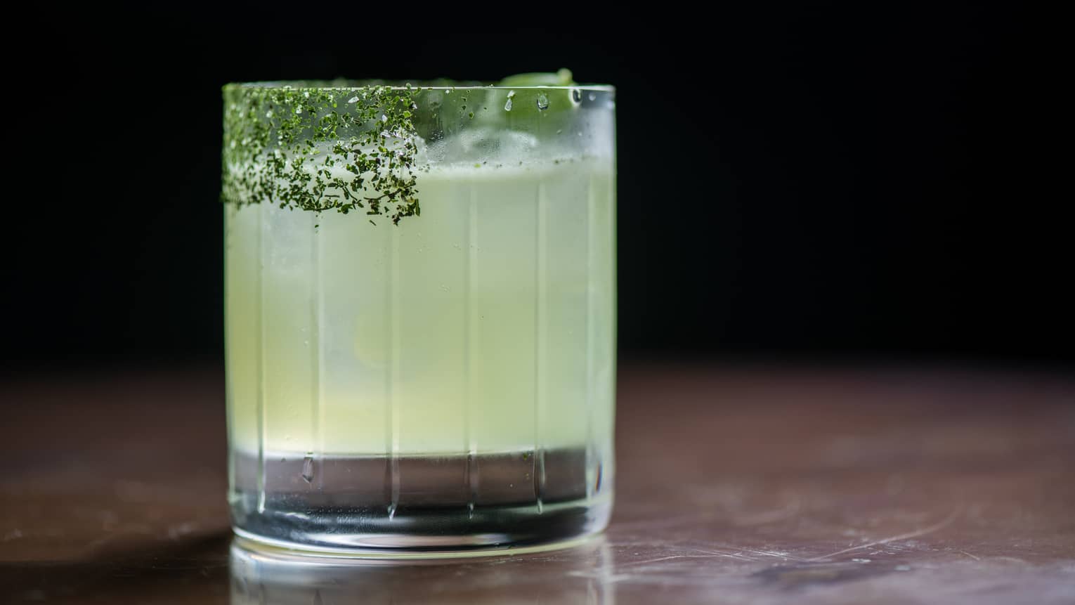 Basil Margarita in a lowball glass with a salt rim