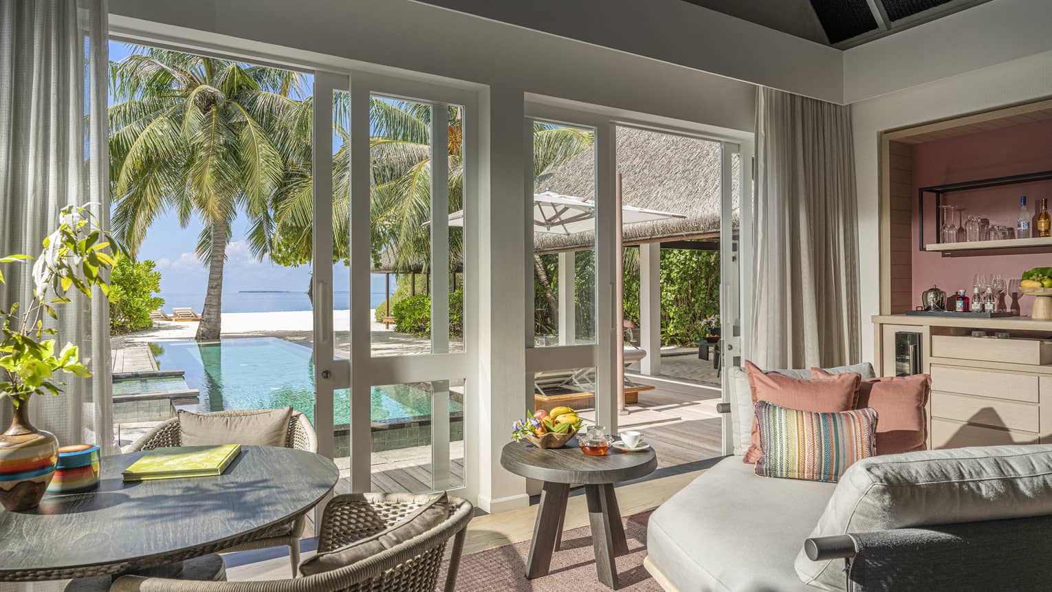 Indoor sitting area and wet bar, leading out to private pool terrace