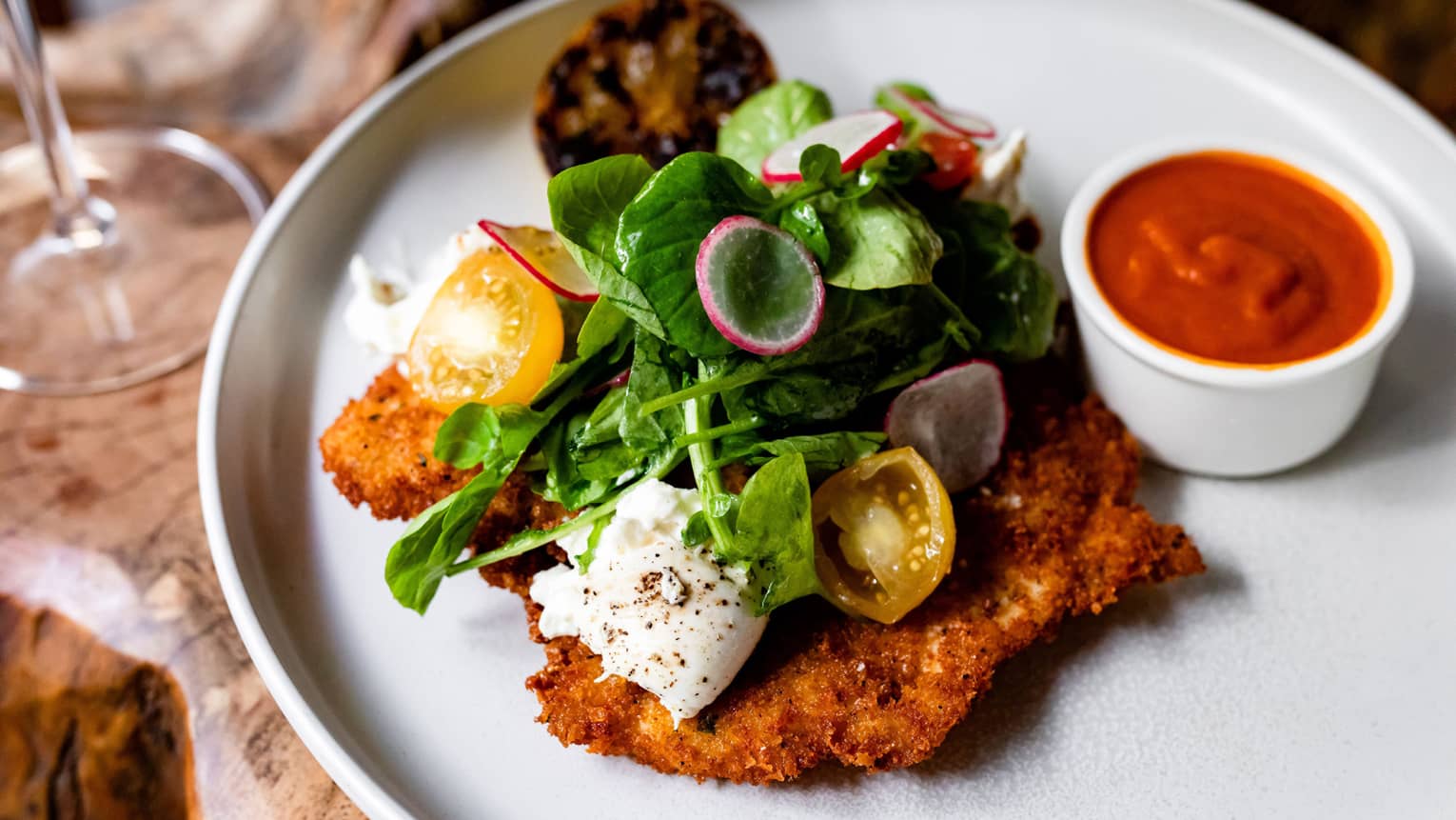 Fried chicken with leafy greens.
