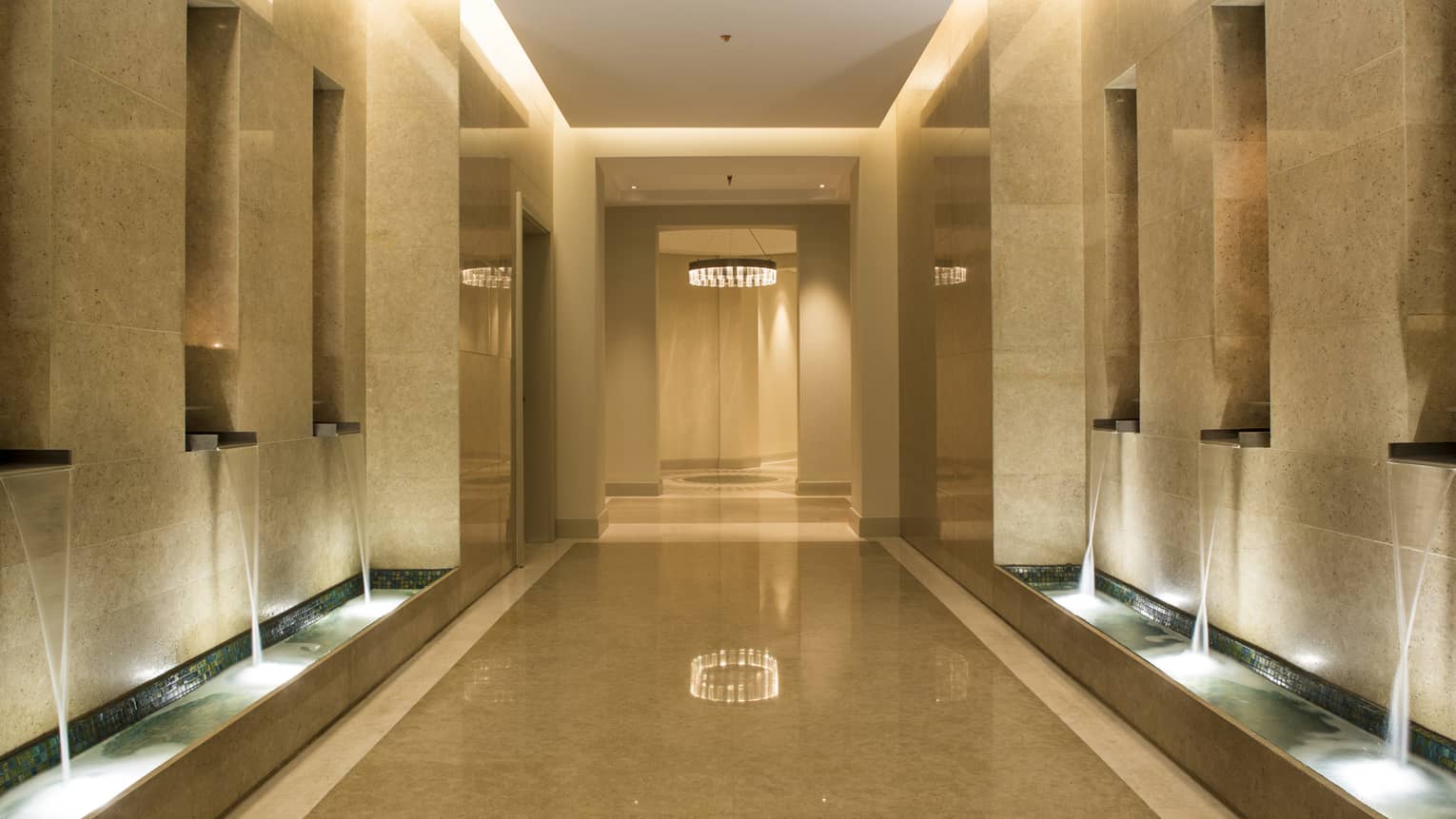 Catamaran sailing on the open water against mountain backdrop