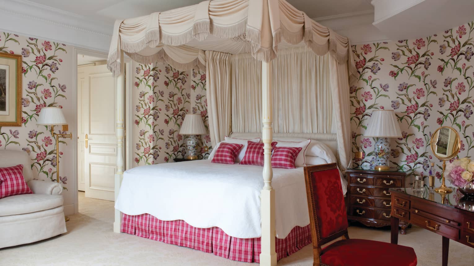 English Suite poster bed with canopy red plaid pillows, skirt, floral wallpaper
