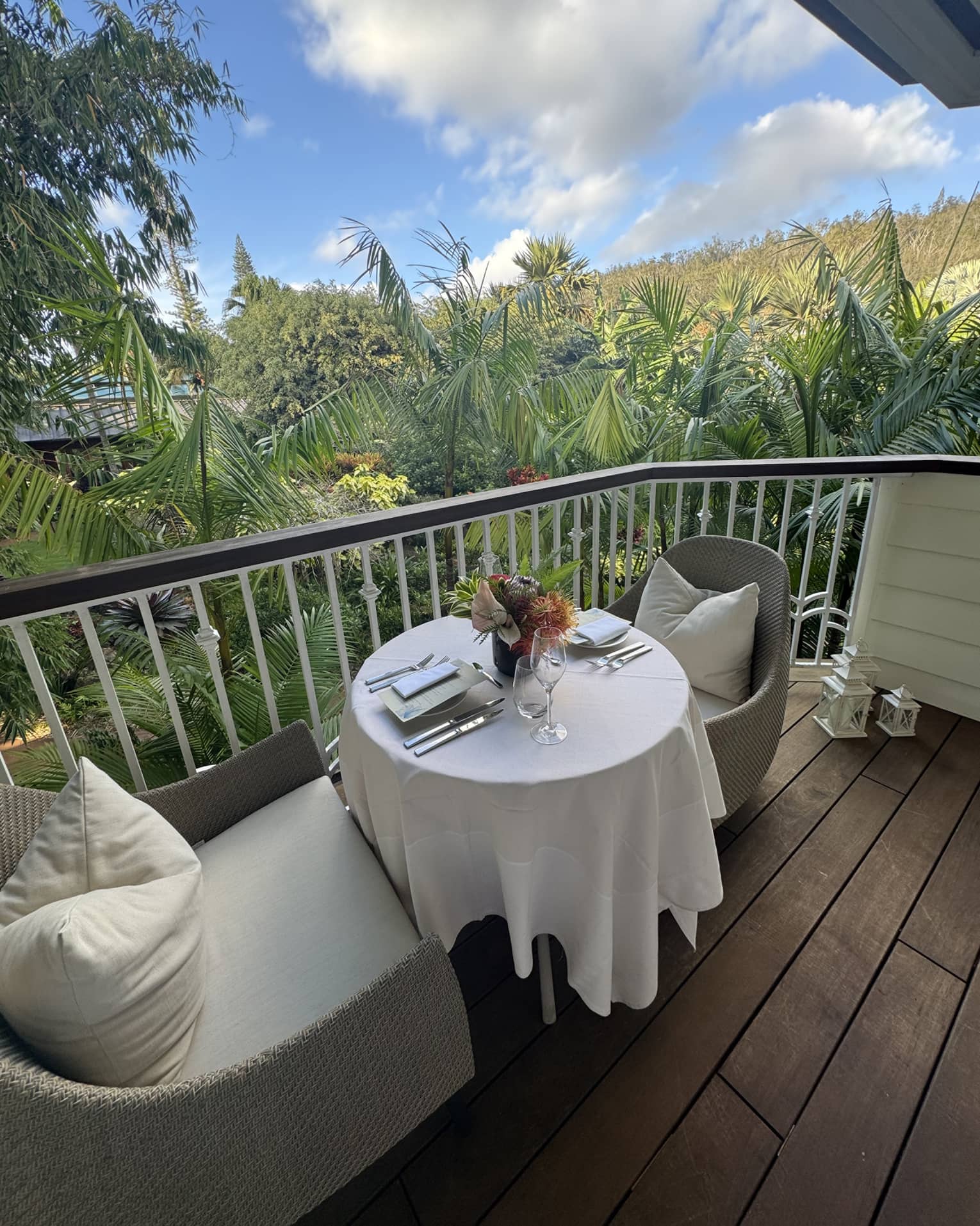 Outdoor private dining on a patio with a view of green tees.