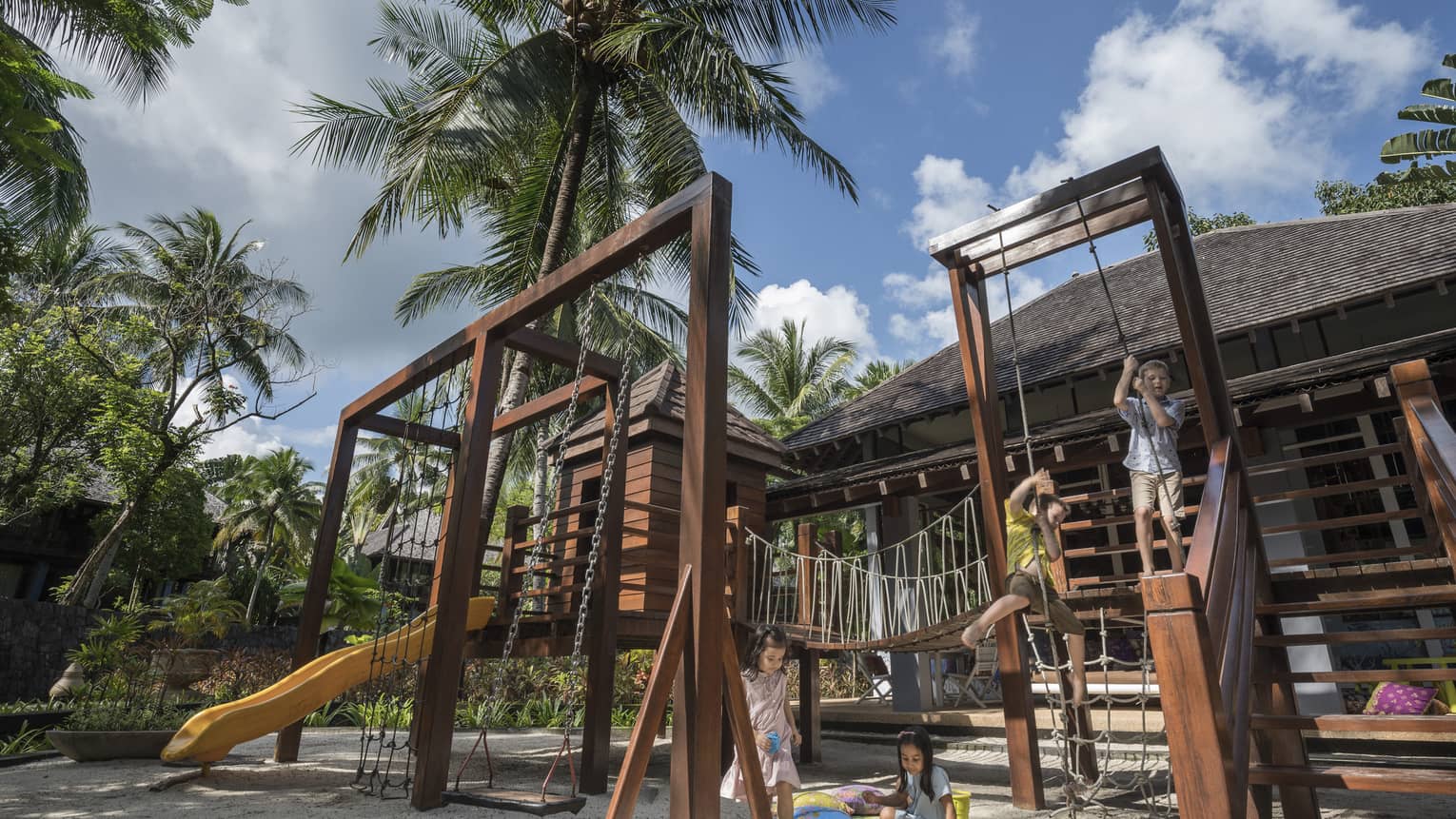Kids playing on the play set in the kids club at Four Seasons Langkawi