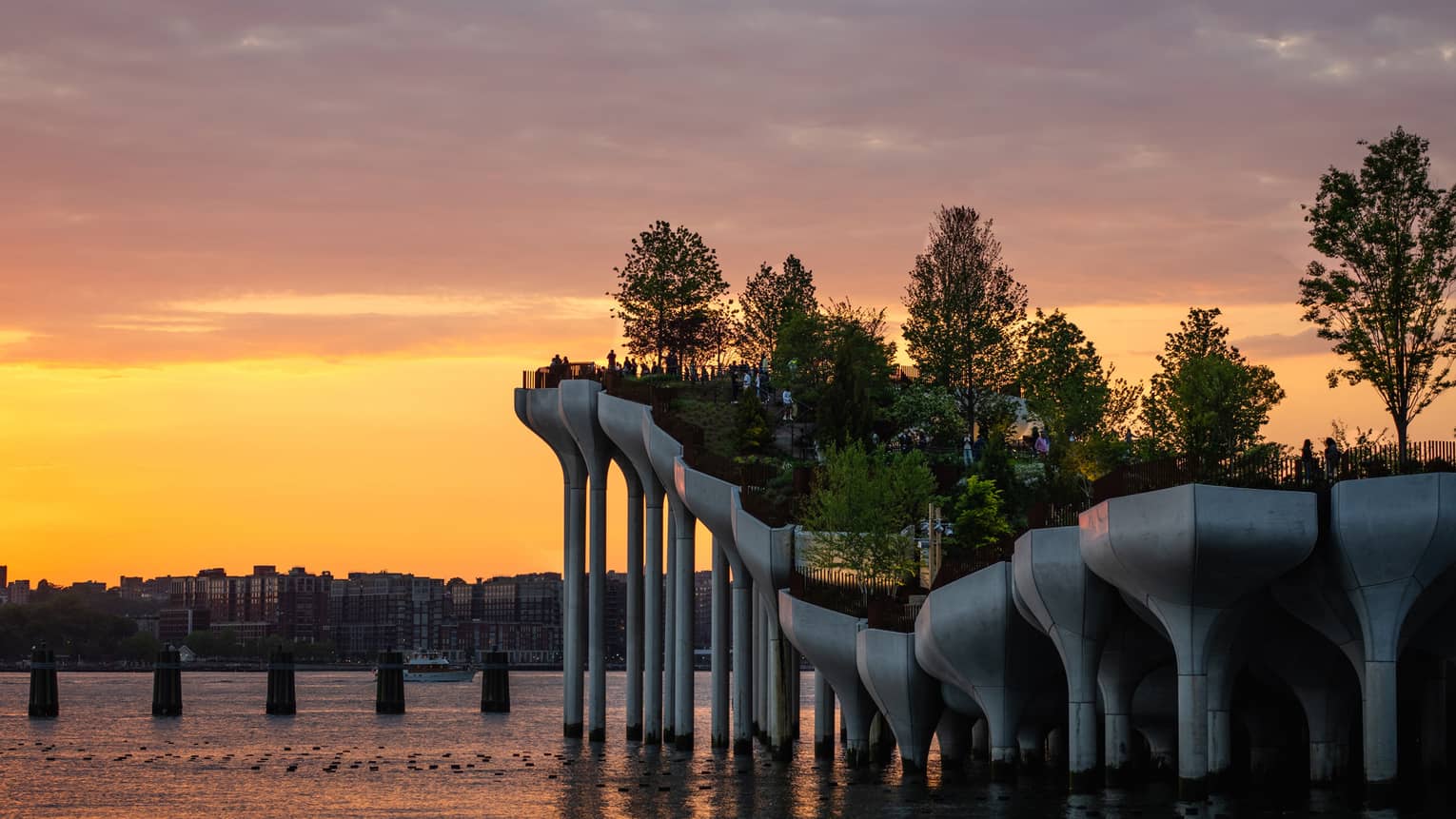 A manmade island on a river with trees.