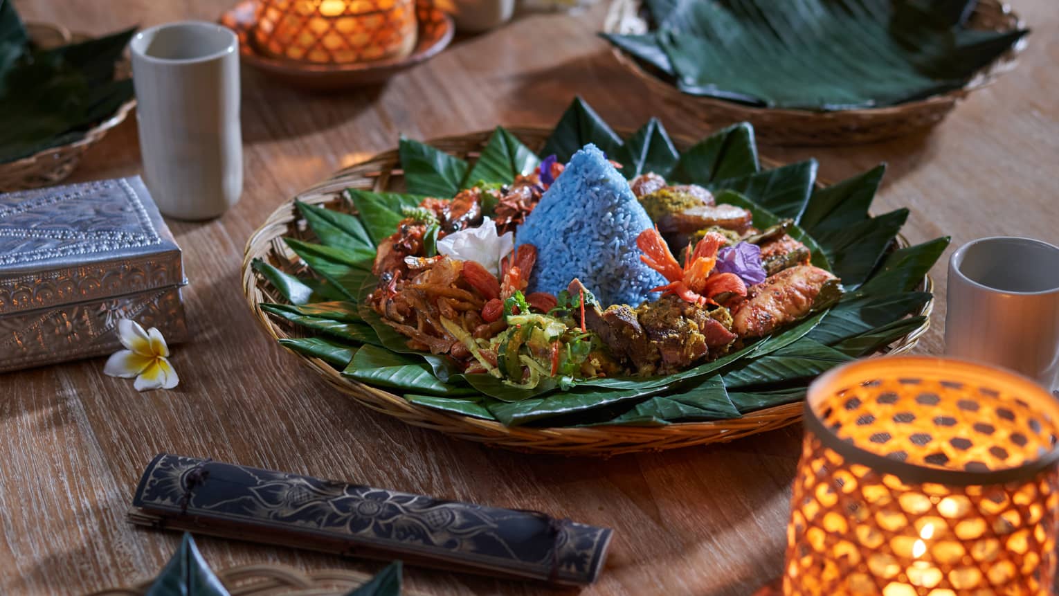 Traditional Balinese cuisine presented on a bed of banana leaves
