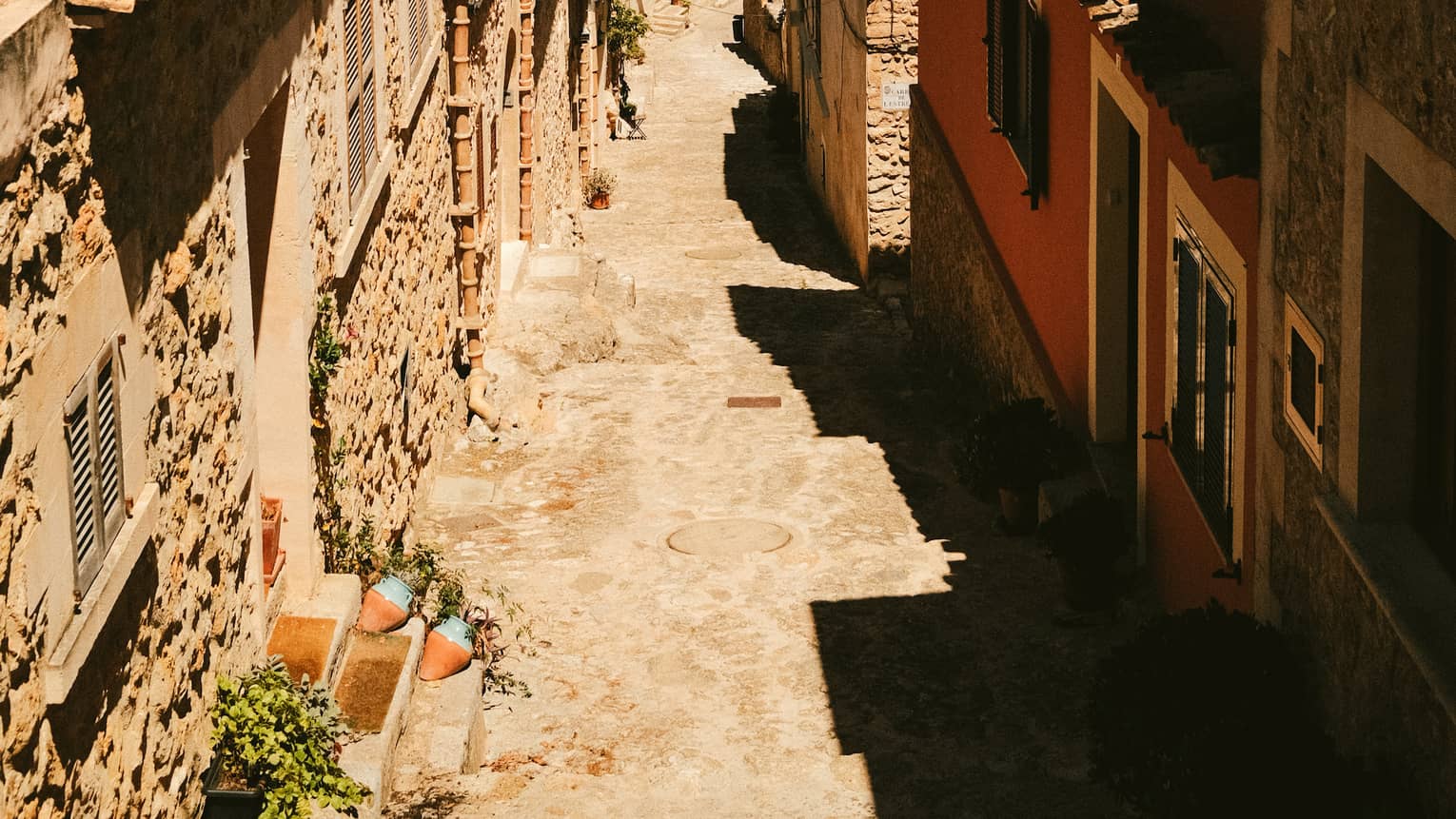 Cobblestone street lined with buildings