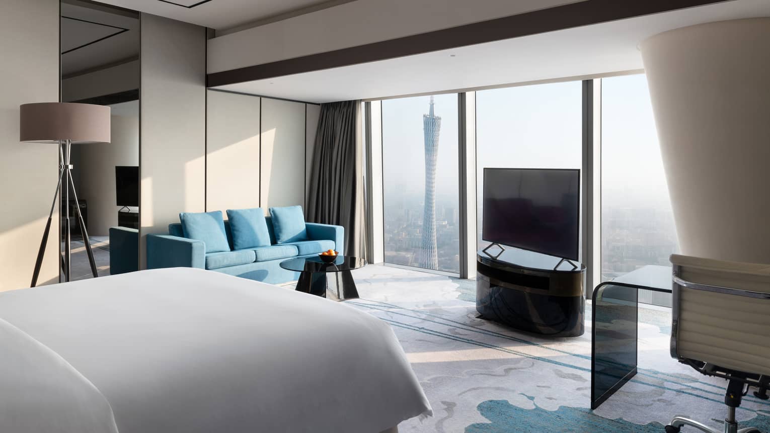 Premier King Canton Tower View Room with blue accents and floor-to-ceiling windows