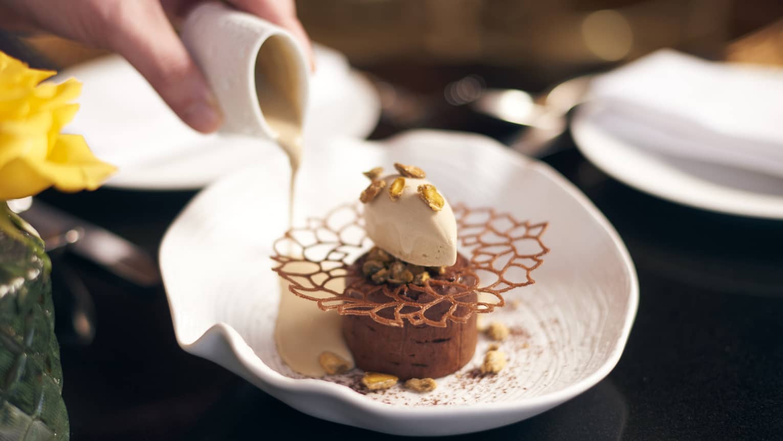 Chocolate mousse with toppings on a white plate